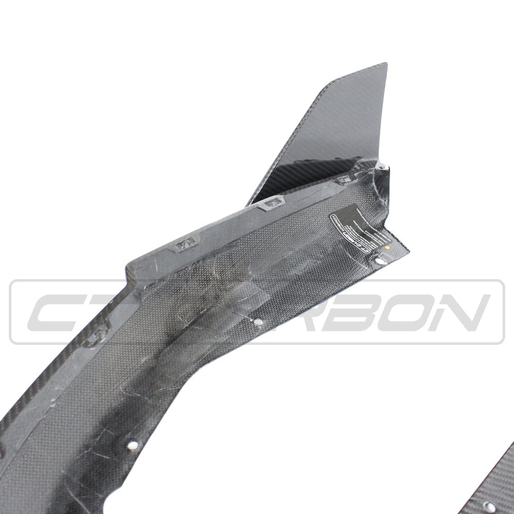 BMW M4 G82/G83 carbon fibre rear bumper corners by CT Carbon, V1, designed for sporty, durable car accessory enhancement.