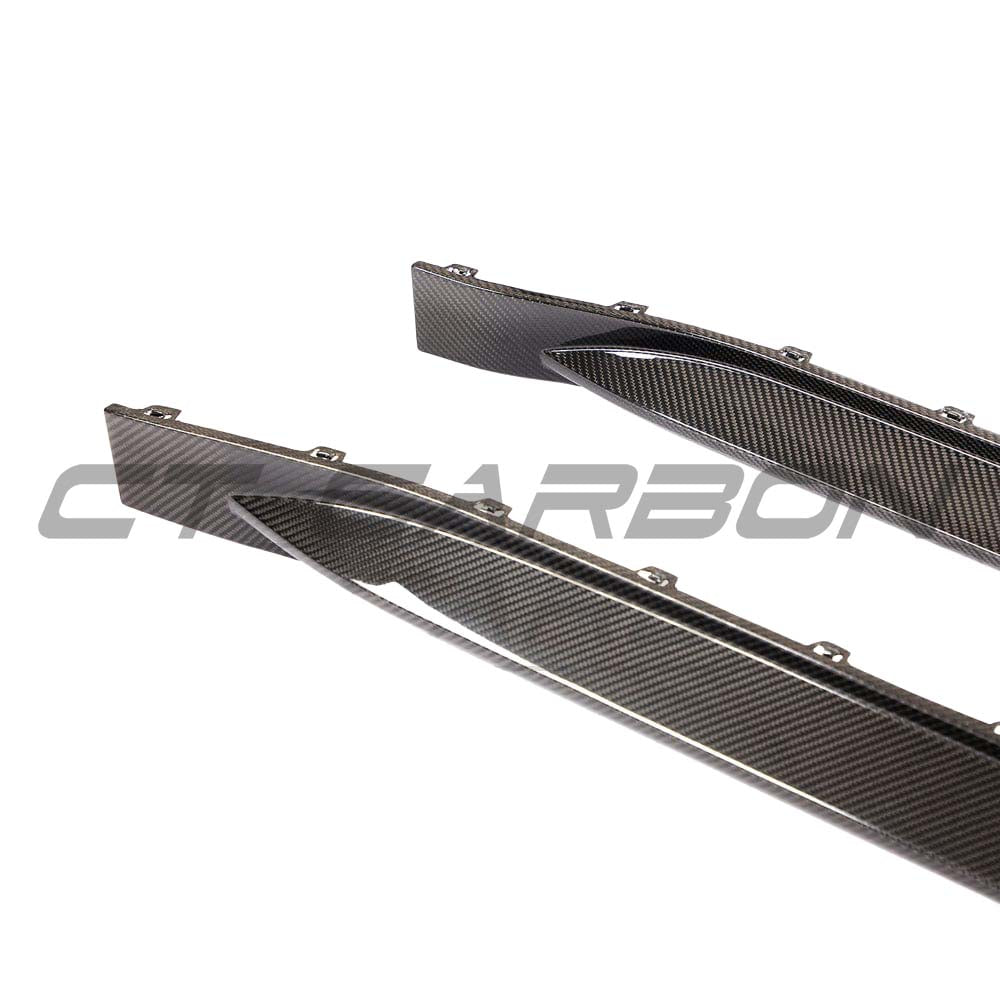 BMW G82 M4 carbon fibre side skirt replacement kit by CT Design, showcasing sleek, lightweight carbon fibre panels on the car.