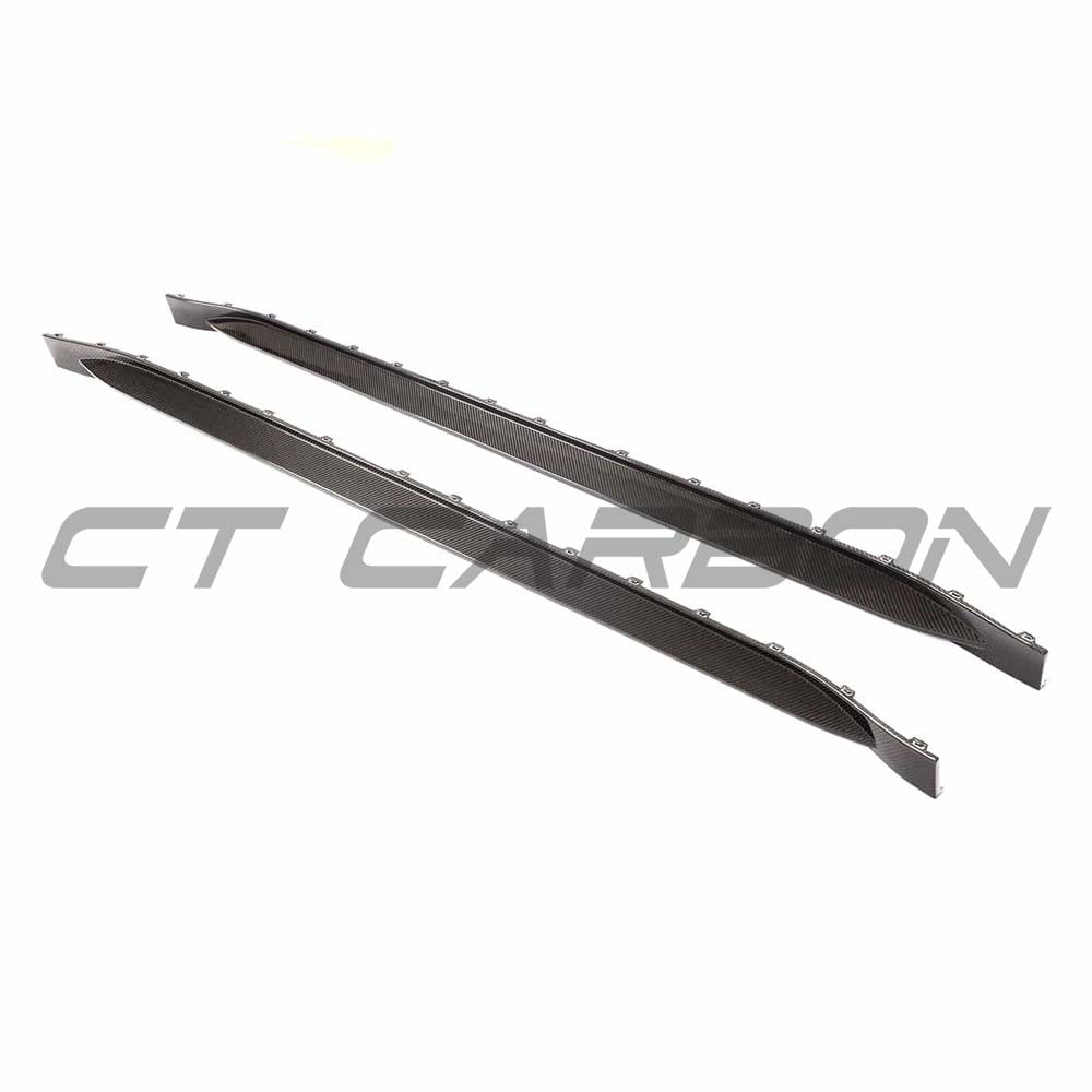 BMW G83 M4 full carbon fibre kit by CT Carbon, featuring side skirts and body enhancements on a sleek M4 vehicle.