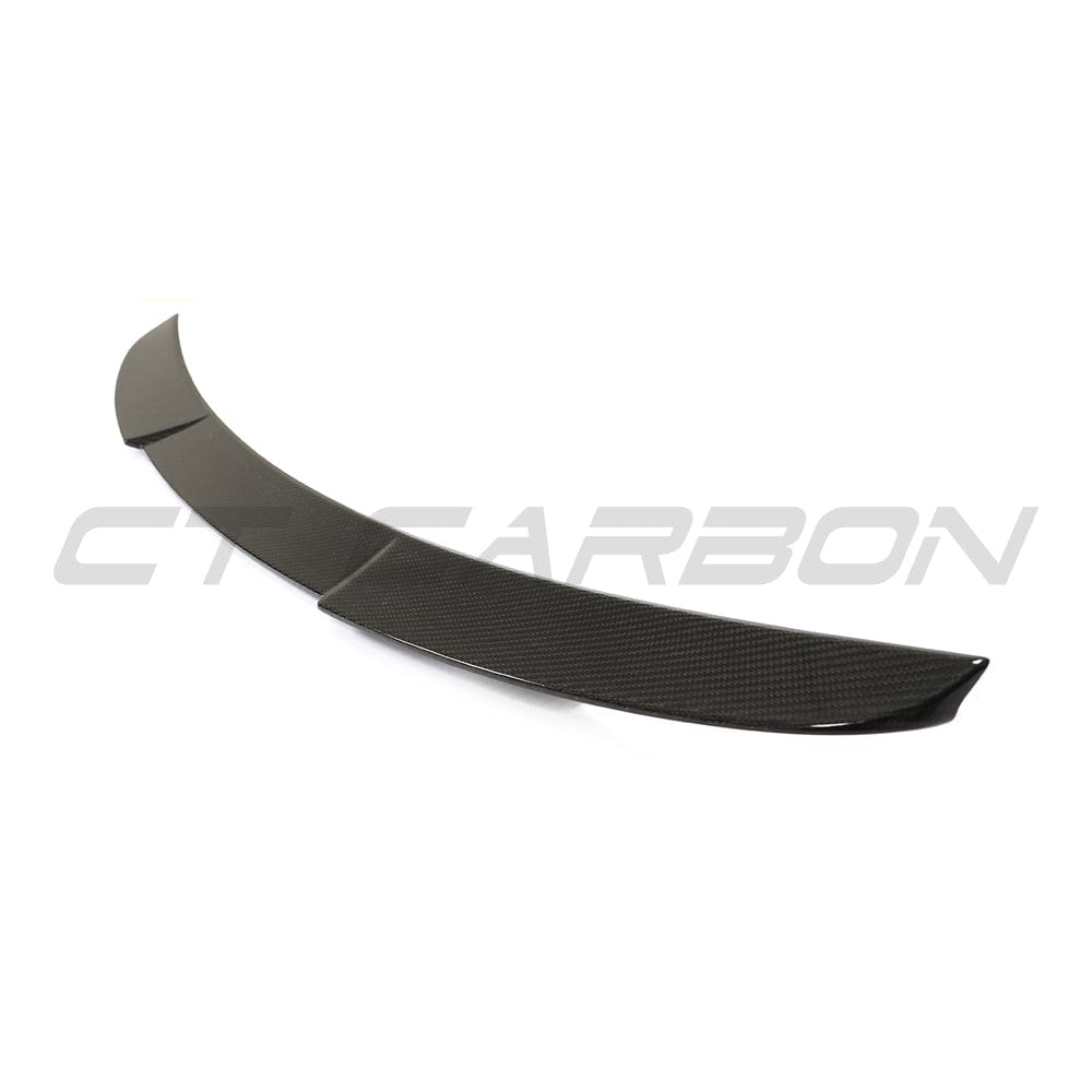 BMW G22 4 Series 2020+ CT Carbon fiber spoiler kit in M4 style, featuring sleek carbon fiber finish on a sporty car.