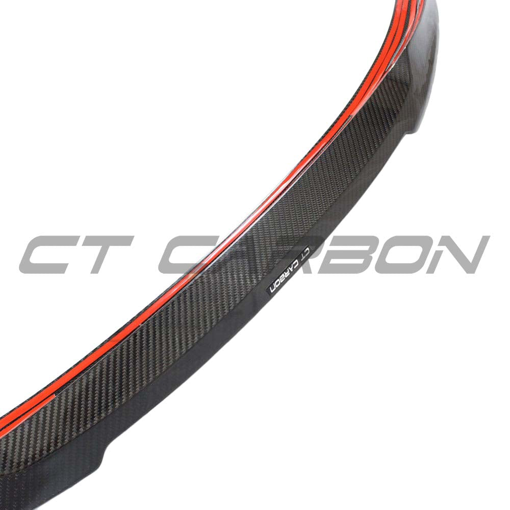 BMW G22 4 Series Carbon Fibre Kit by CT Carbon, featuring V11 style spoiler, shown in a close-up of the sleek carbon fibre finish.
