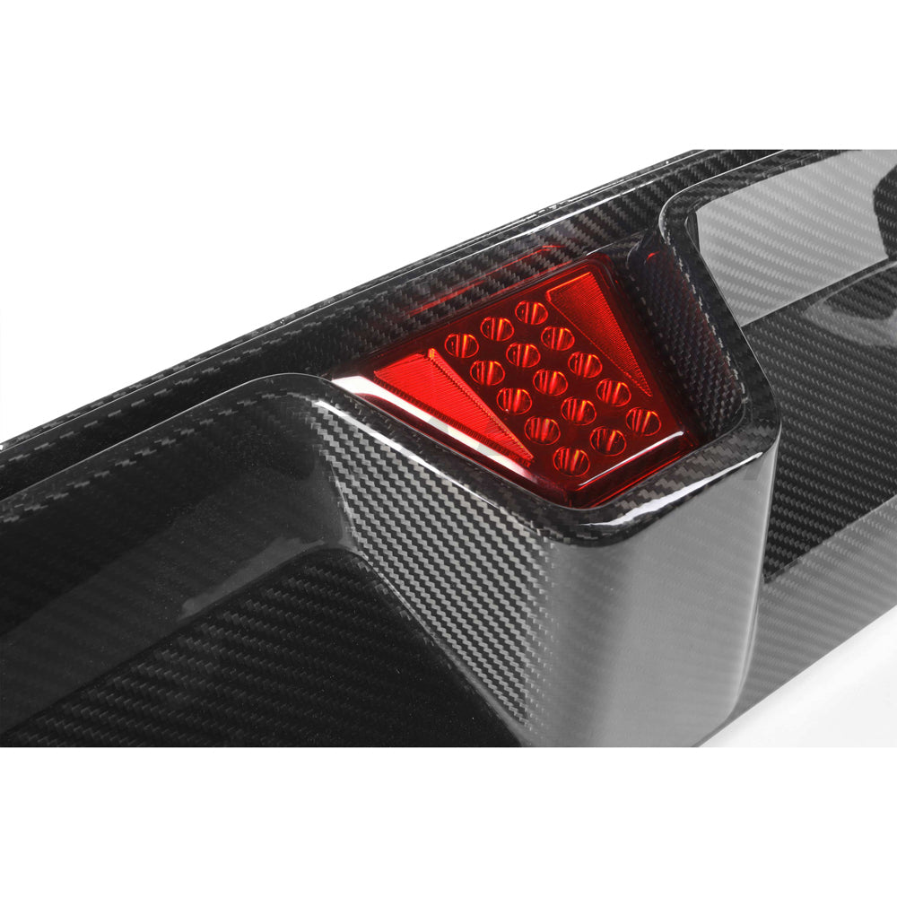 BMW M5 F90 2018-2024 CT Carbon pre-preg carbon fiber diffuser with LED lights, featuring a V4 CS style design.