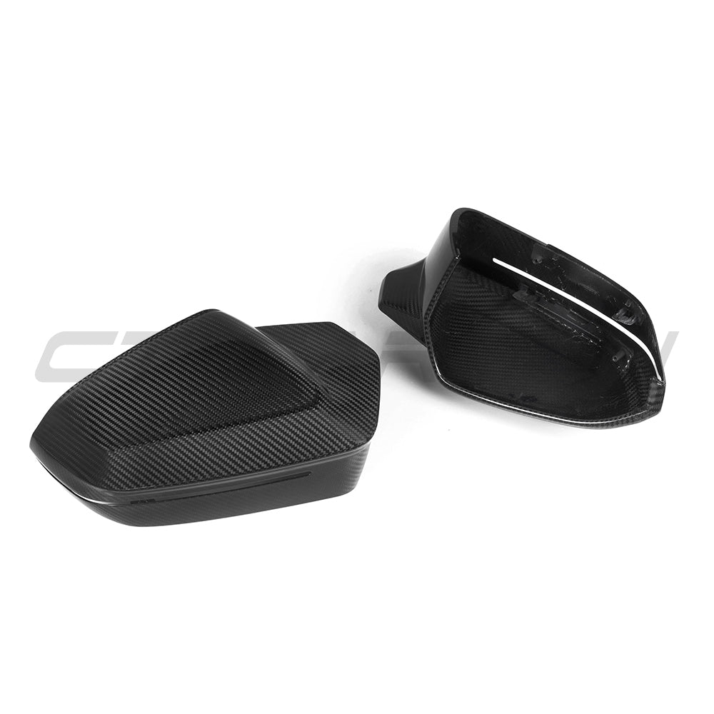 BMW M5 G90 G99 and i5 M60 G60 carbon fiber side mirrors by CT Carbon, LHD, showcasing sleek, lightweight aerodynamic design.