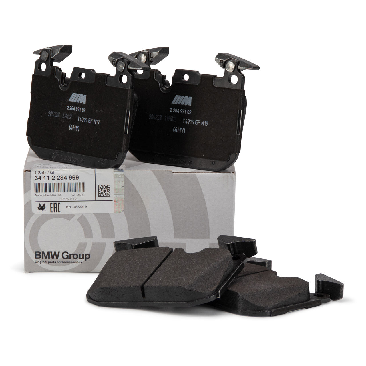 Set of brake pads with BMW Group packaging on a white background