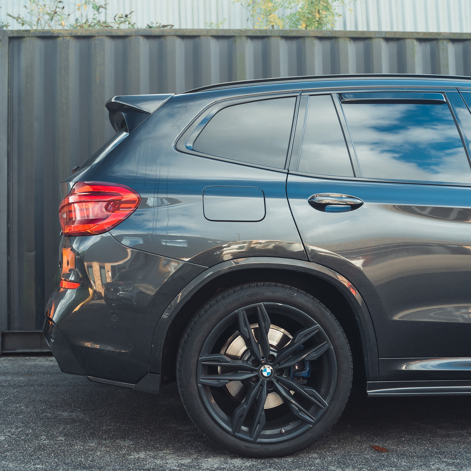 BMW X3 G01 carbon fibre spoiler by CT Carbon, showcasing sleek aerodynamic design on the vehicle's rear.