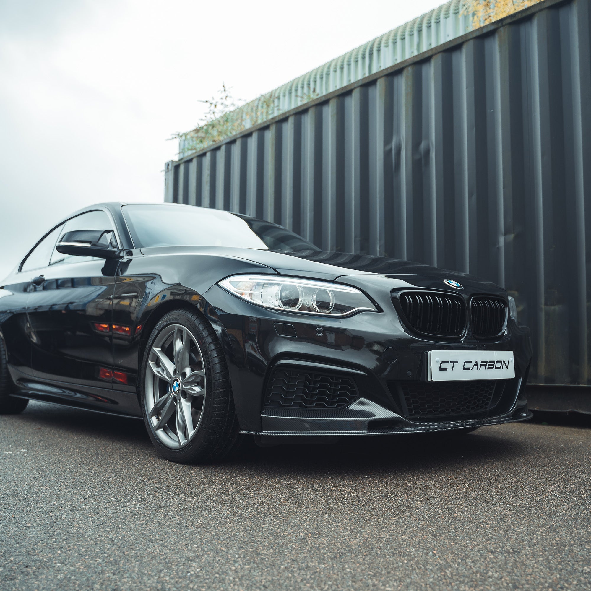 BMW F22 2 Series full carbon fiber kit by CT Carbon, showing detailed carbon fiber components on a sleek car.