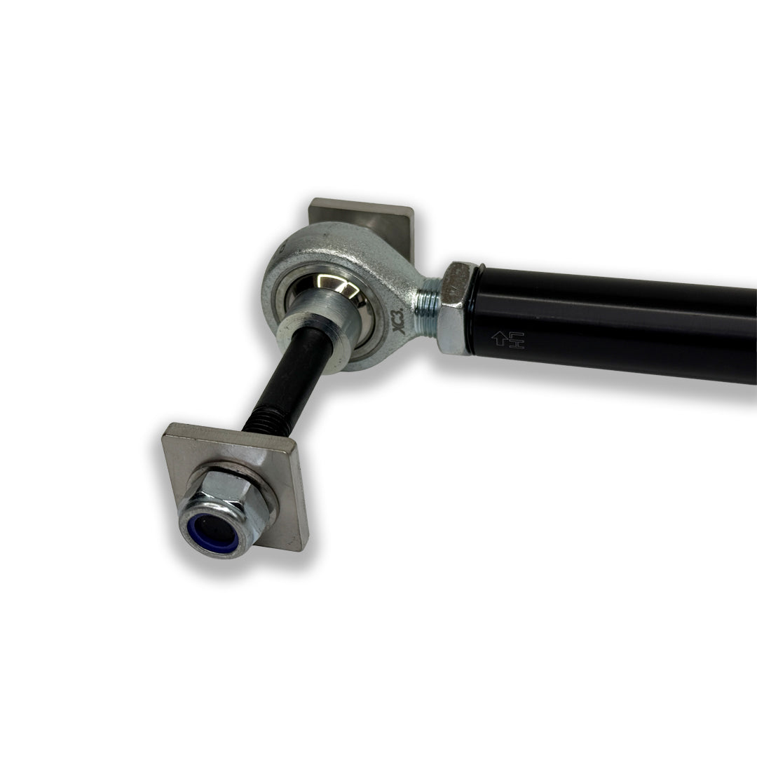 BMW M3 E9X/E90/E92/E93 adjustable rear toe arms for suspension and alignment by XC3 Engineering, shown installed on the vehicle.