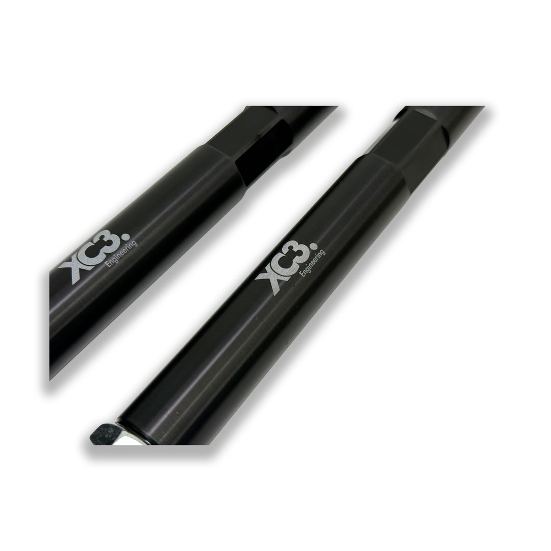 BMW M3 E9X/E90/E92/E93 adjustable rear toe arms for suspension and alignment by XC3 Engineering, showing the metal components.