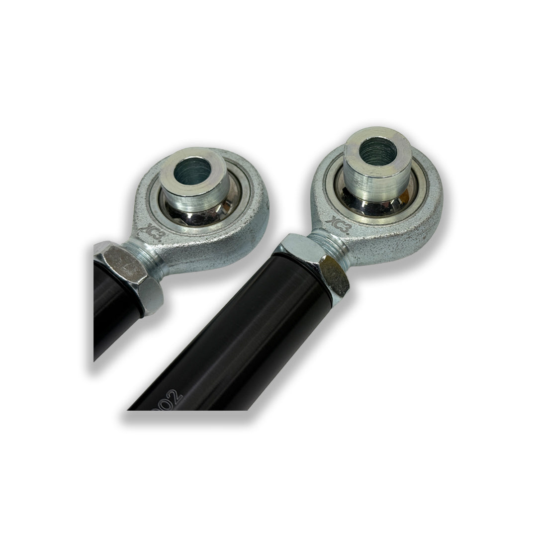BMW M3 E9X/E90/E92/E93 adjustable rear toe arm for suspension and alignment by XC3 Engineering, shown installed on the vehicle.