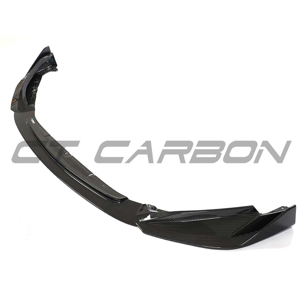 BMW G83 M4 full carbon fiber kit by CT Carbon, including front splitter and aerodynamic enhancements, mounted on the car.