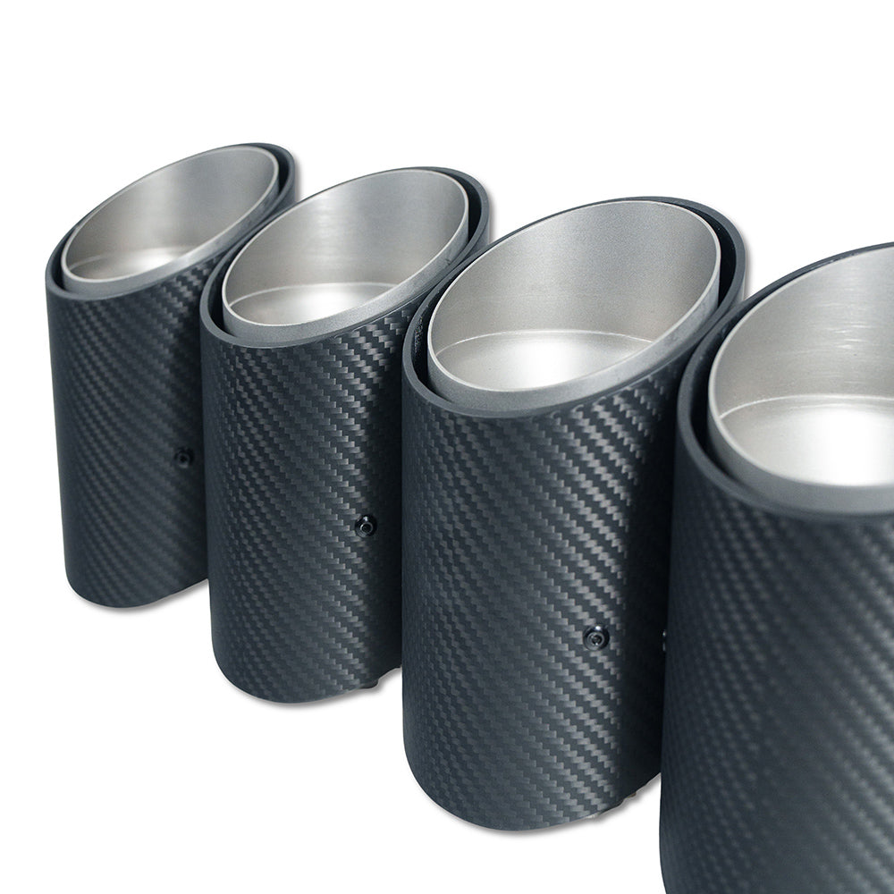 Chrome carbon fibre exhaust tips for BMW G90 M5 and G99 M5 Touring from CT Carbon, slash cut design, front view.