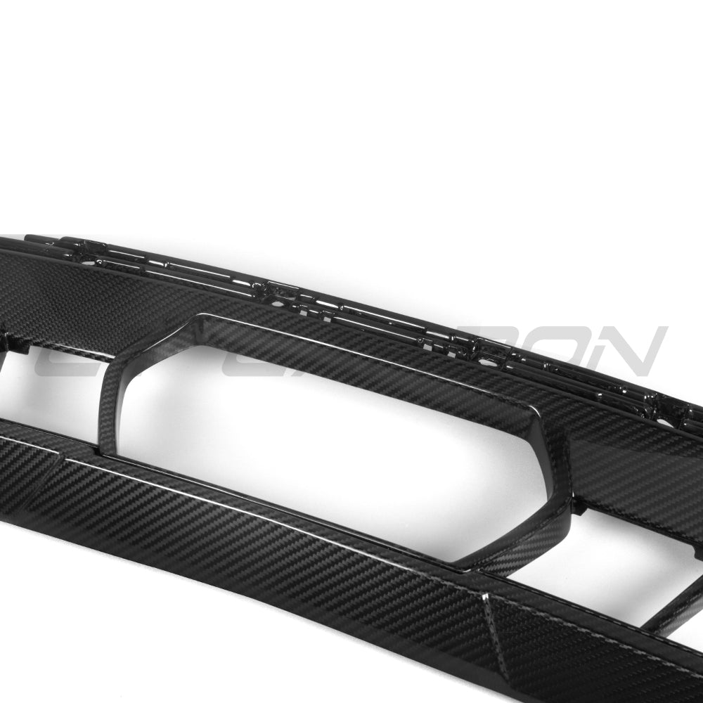 BMW G05 X5 LCI 2023+ CT Carbon front middle bumper trim in carbon fiber, close-up view showing textured finish and fitment details.