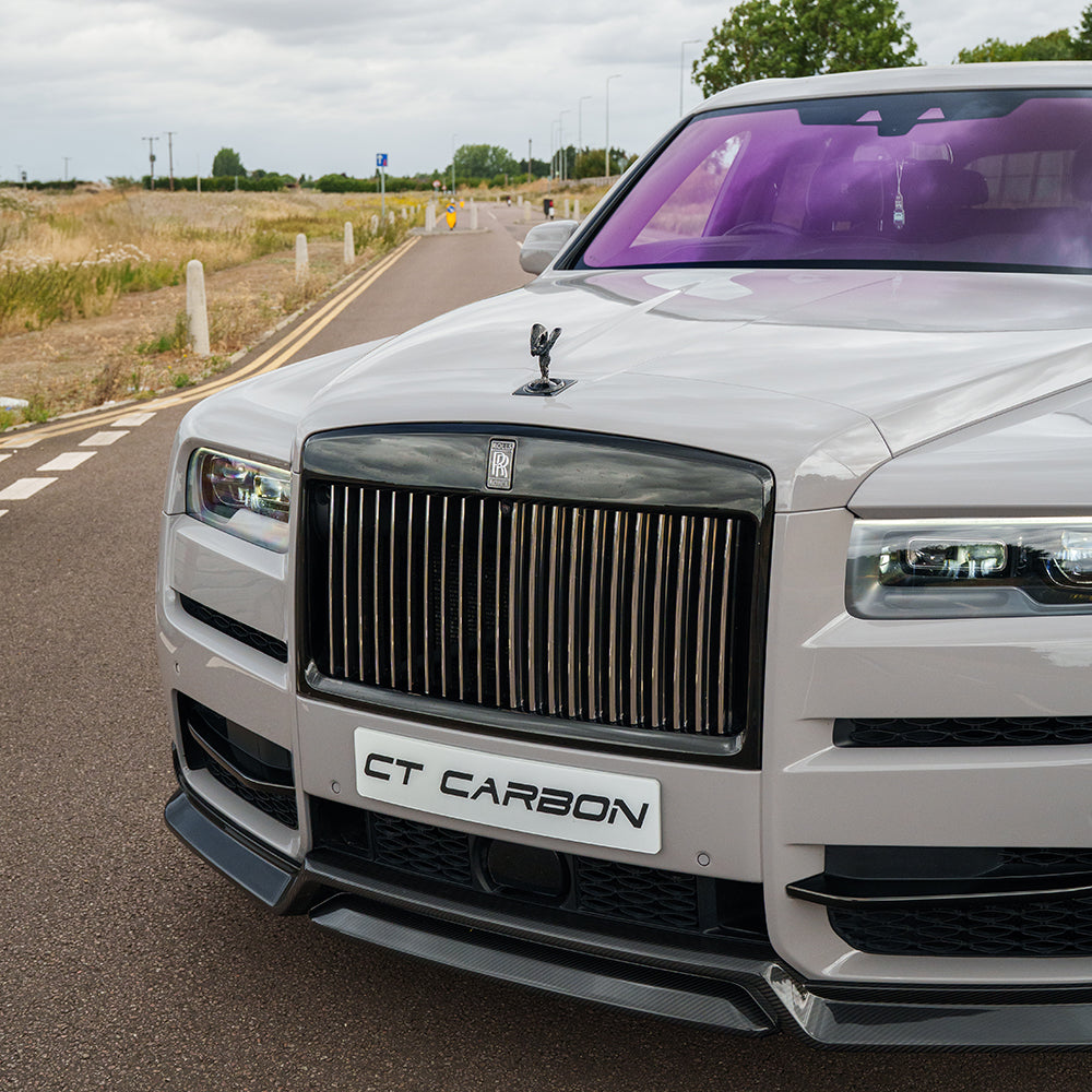 Full view of a Rolls Royce Cullinan with CT Carbon full carbon fiber kit installed, showcasing the sleek, glossy carbon fiber exterior.