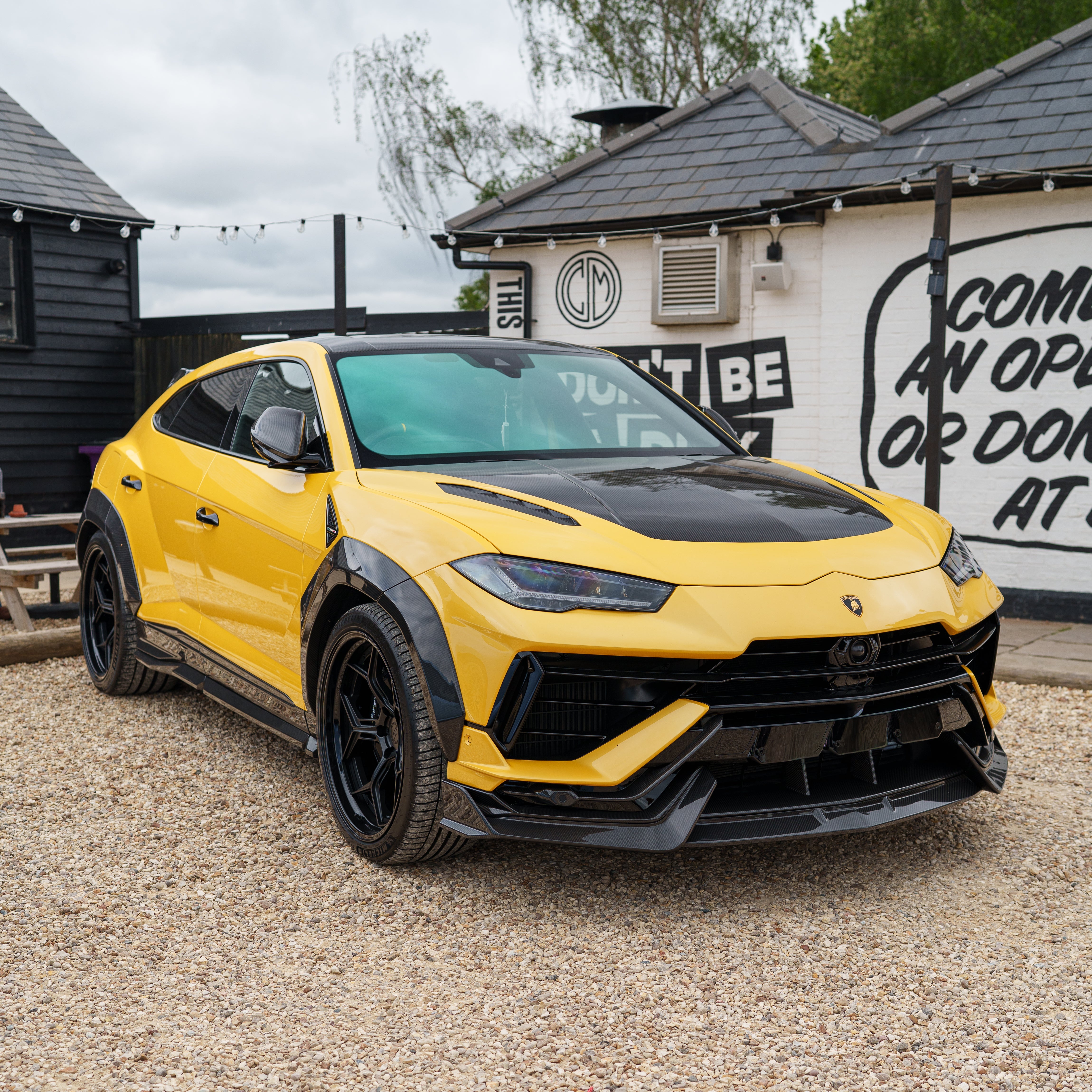 CT Carbon Lamborghini Urus Performante carbon fibre arches installed on the vehicle, showcasing lightweight and high-performance design.