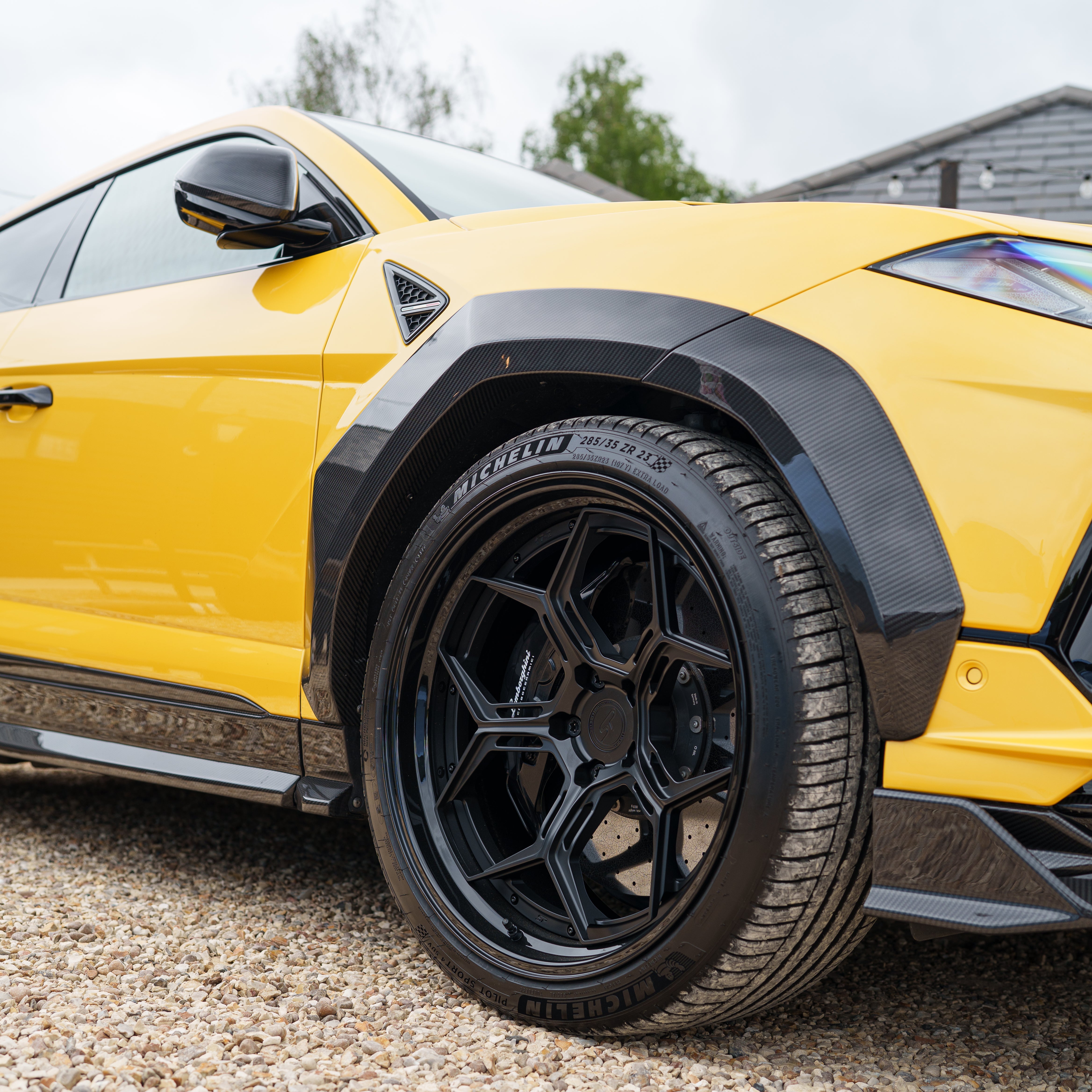 CT Carbon Lamborghini Urus Performante carbon fibre arches, showcasing sleek, lightweight car arch design with detailed carbon fibre texture.