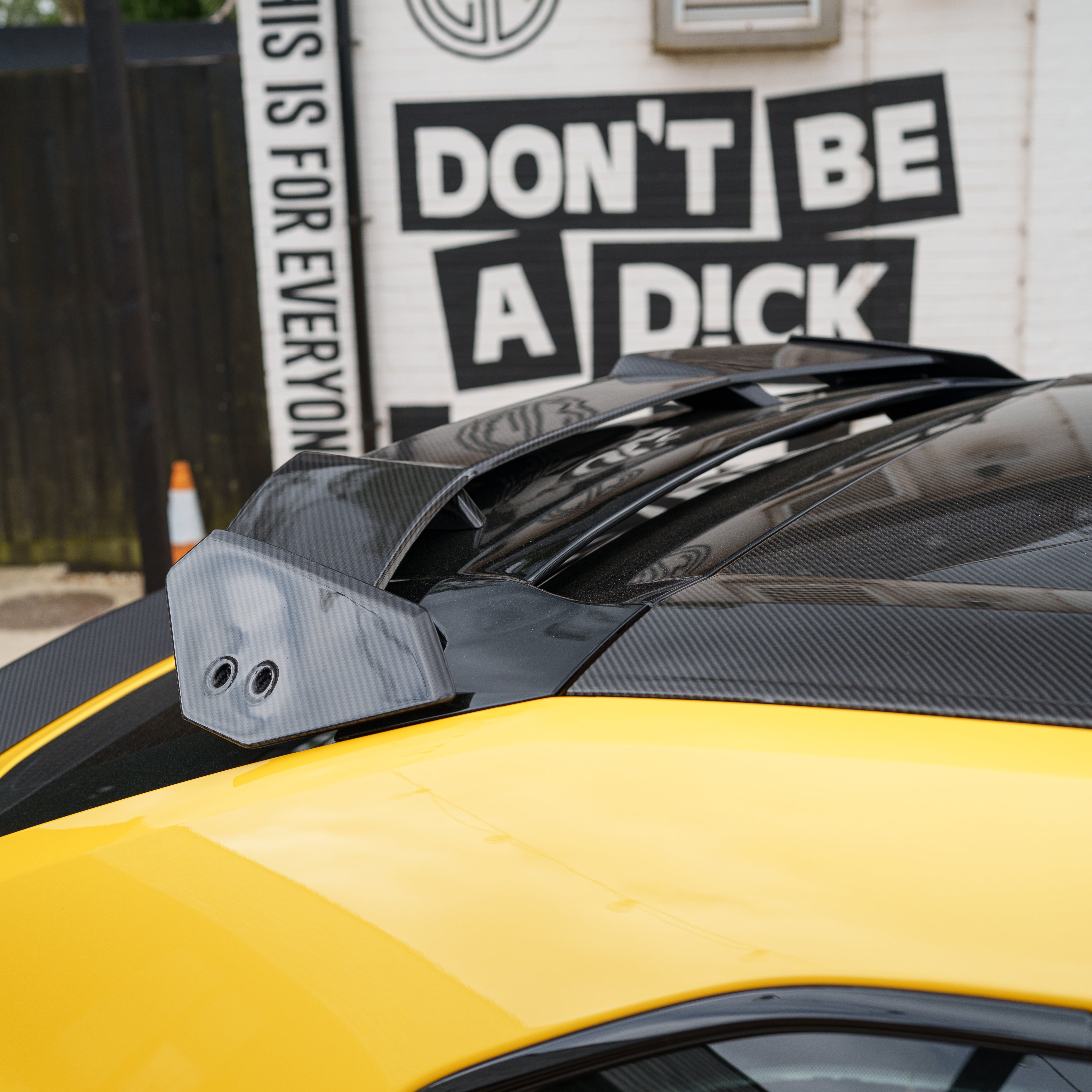 Lamborghini Urus Performante carbon fibre spoiler by CT Carbon, showing sleek aerodynamic design on the car's rear.