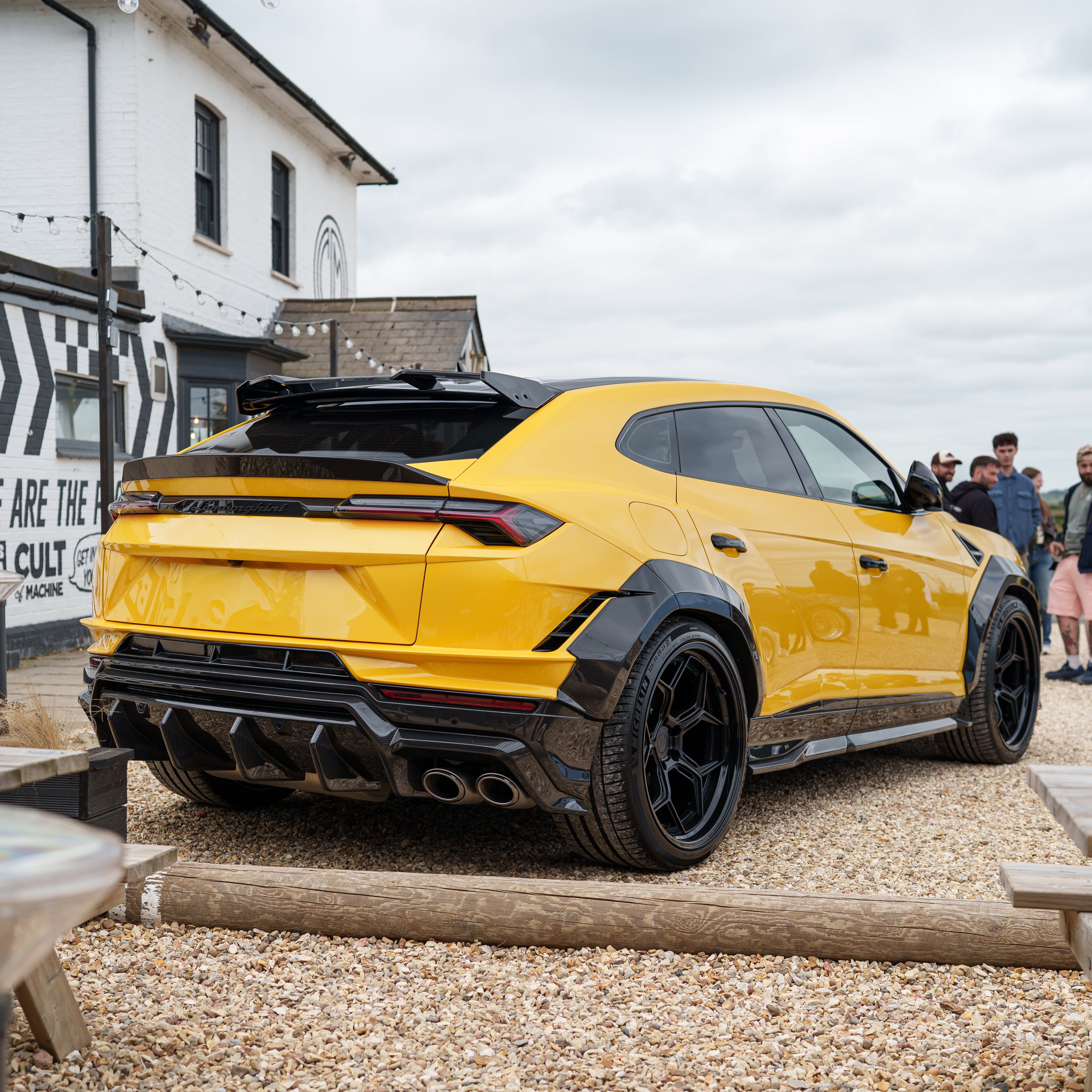 CT Carbon Lamborghini Urus Performante carbon fibre spoiler mounted on the vehicle, showcasing sleek aerodynamic design.