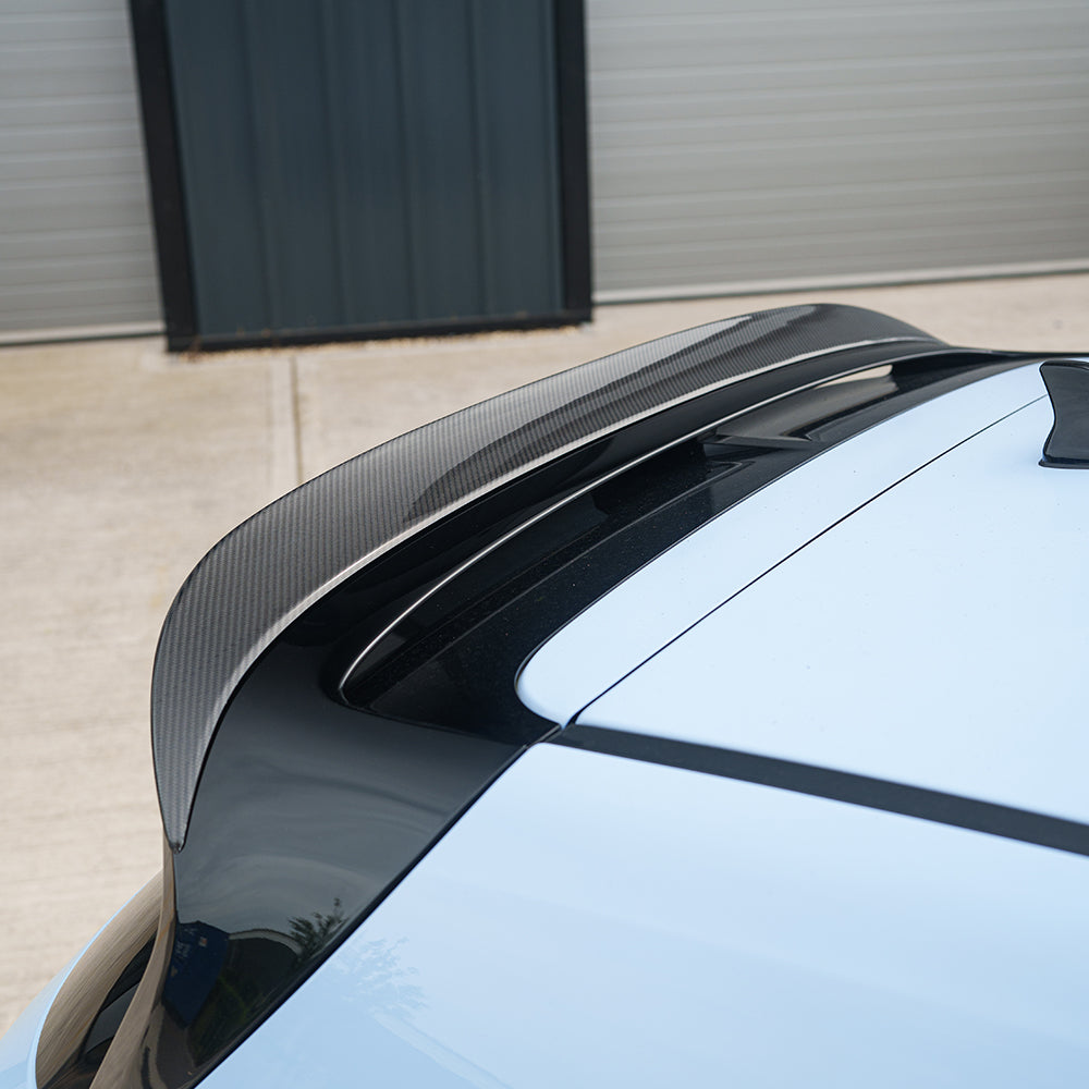Hyundai i30N carbon fibre spoiler by CT Carbon installed on the car, showcasing sleek aerodynamic design and glossy finish.