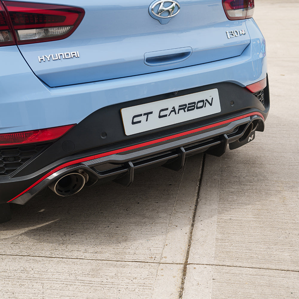 Hyundai i30N CT Design carbon fiber diffuser featuring sleek, aerodynamic design for enhanced vehicle performance and style.