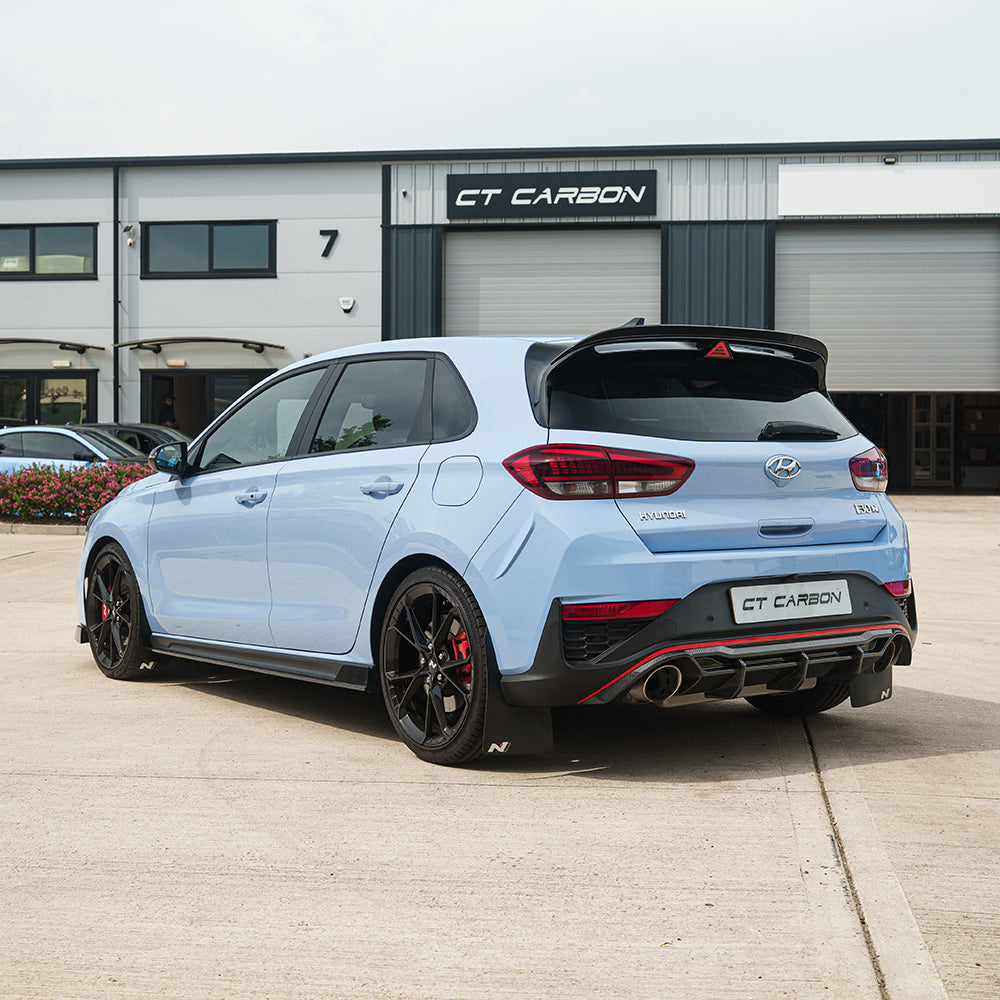 Carbon fiber spoiler for Hyundai i30N by CT Carbon, shown installed on the car’s rear with sleek, aerodynamic design.