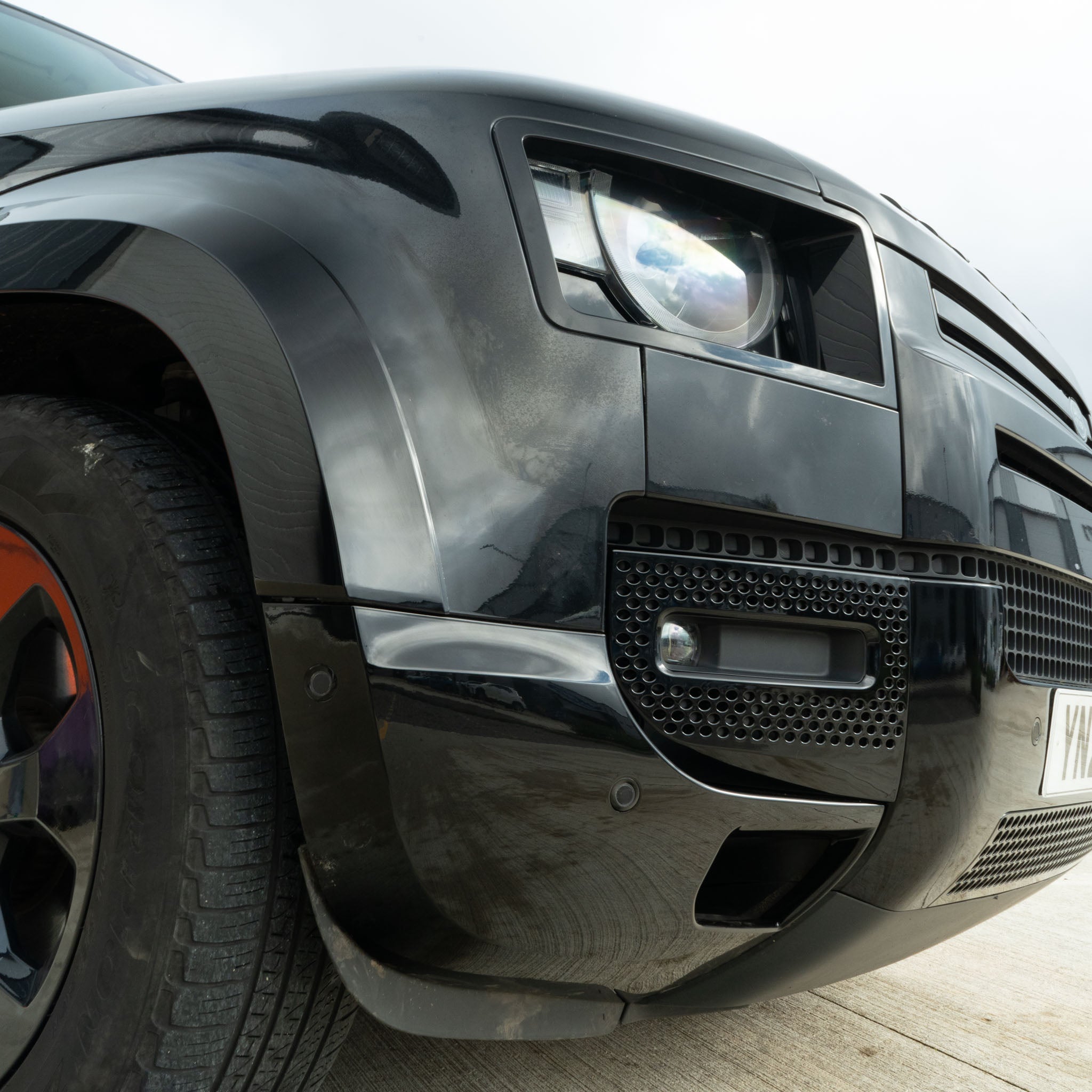 CT Carbon Land Rover Defender L663 90/110 bumper corners in gloss black, front and rear, durable car accessory for off-road style.