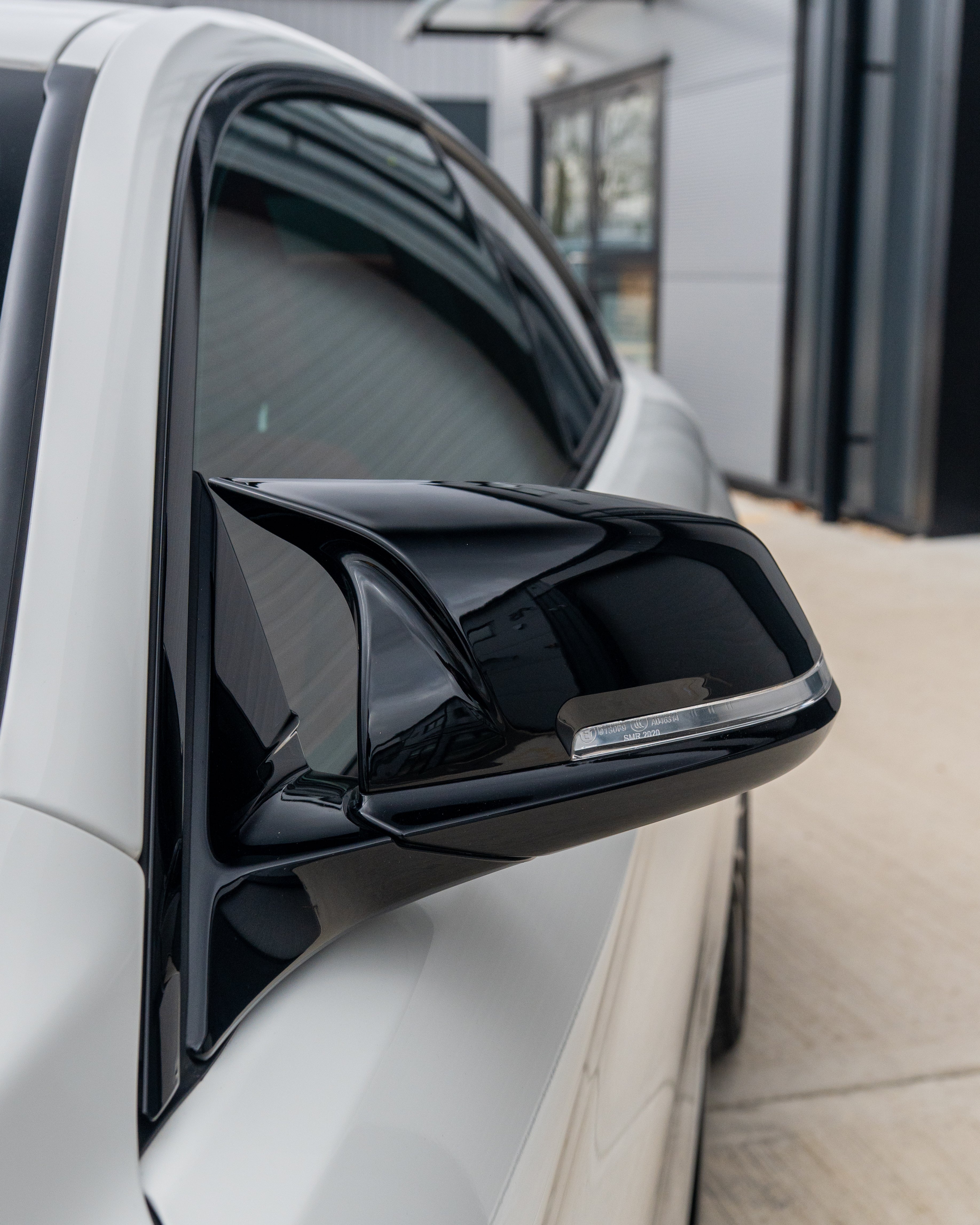 BMW Fxx series mirrors by CT Carbon, gloss black side mirrors for 1, 2, 3, and 4 Series with sleek, aerodynamic design.