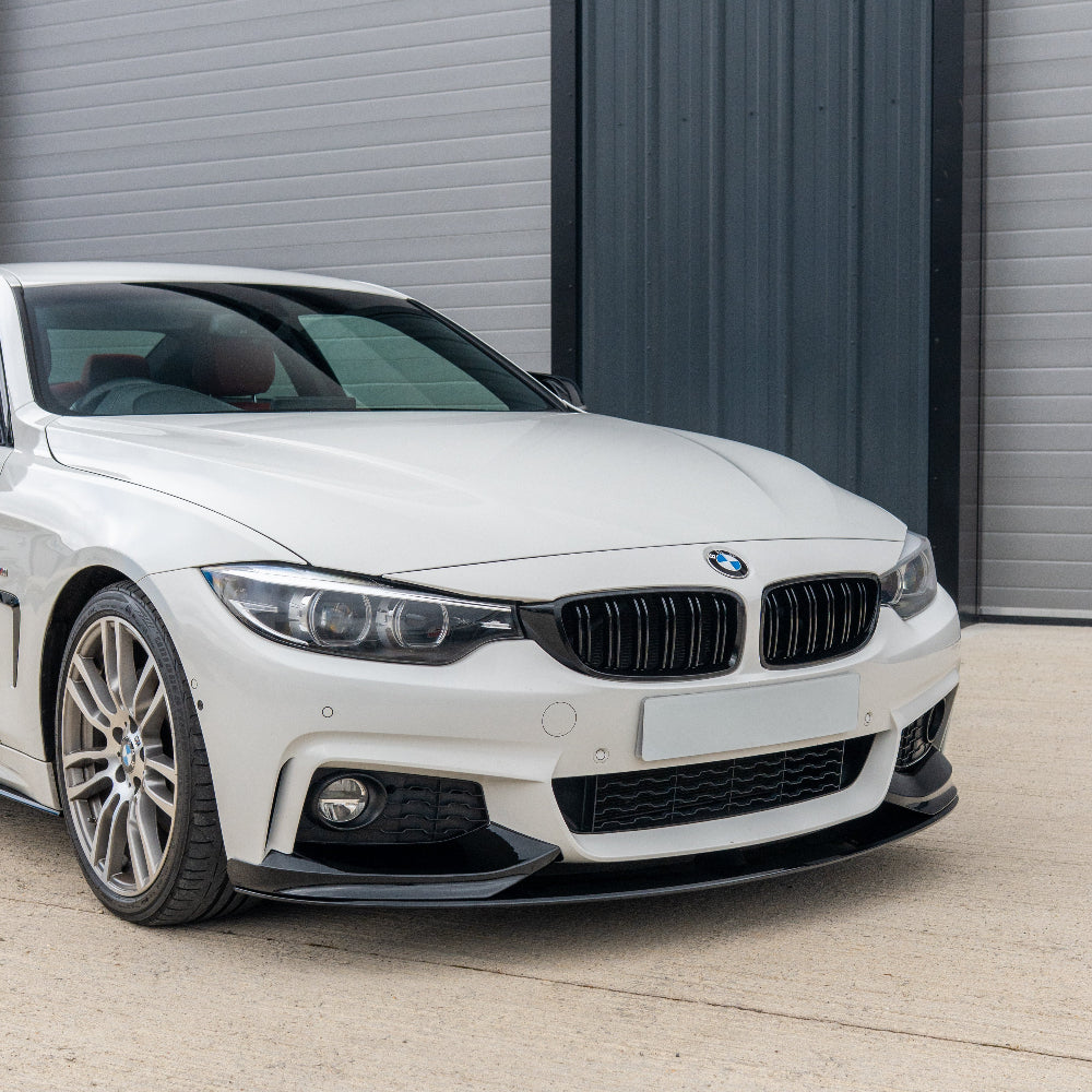 BMW 4 Series F32/F33/F36 CT Carbon gloss black splitter installed on front bumper, showcasing a sleek aerodynamic design.