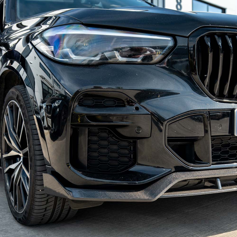 BMW G05 X5 full carbon fiber kit by CT Carbon, showing close-up of carbon fiber panels and detailed fitment on the vehicle.