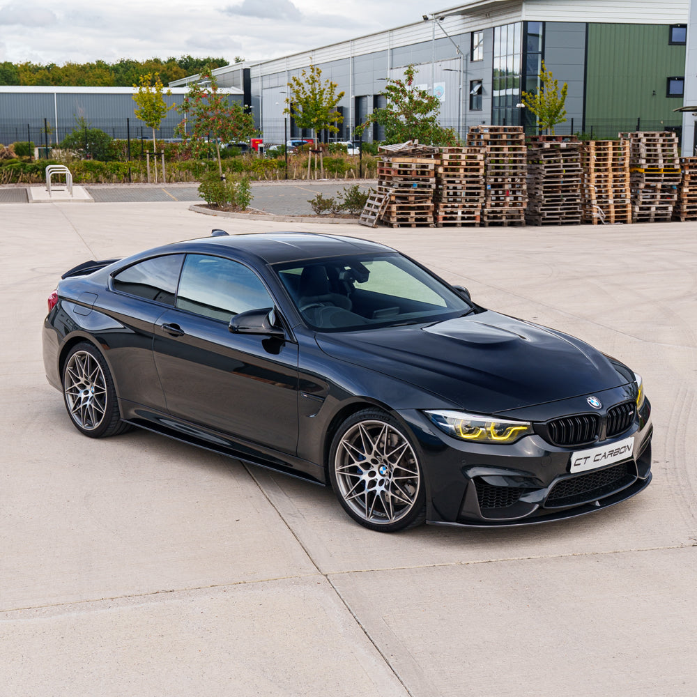 BMW F82 M4 Coupe 2014-2020 CT Carbon V4 full carbon fibre kit installed on the car, showcasing sleek, lightweight carbon fibre components.