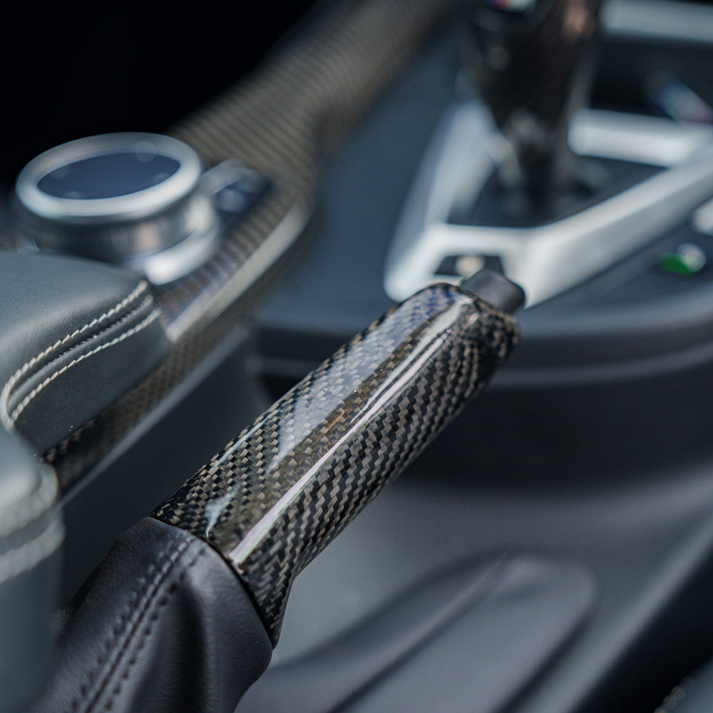 BMW Fxx carbon fiber hand brake lever accessory by CT Carbon, showcasing the sleek, lightweight carbon fiber finish.