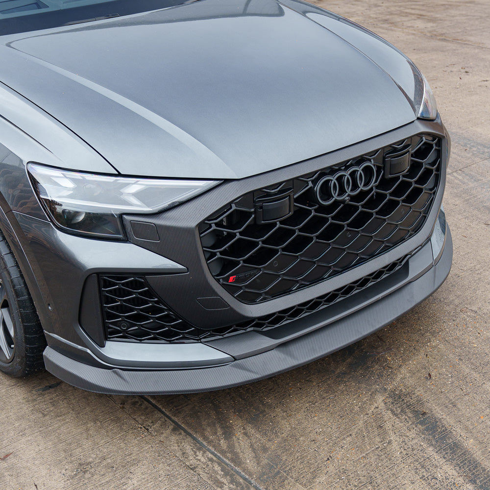 Carbon fiber splitter for Audi RSQ8 facelift 2025+ by CT Carbon, shown installed on the front of the vehicle.