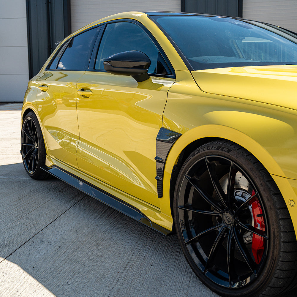 Carbon fiber front fender trim for Audi RS3 8Y 2022+ by CT Carbon, showcasing sleek, lightweight accessory for enhanced style.
