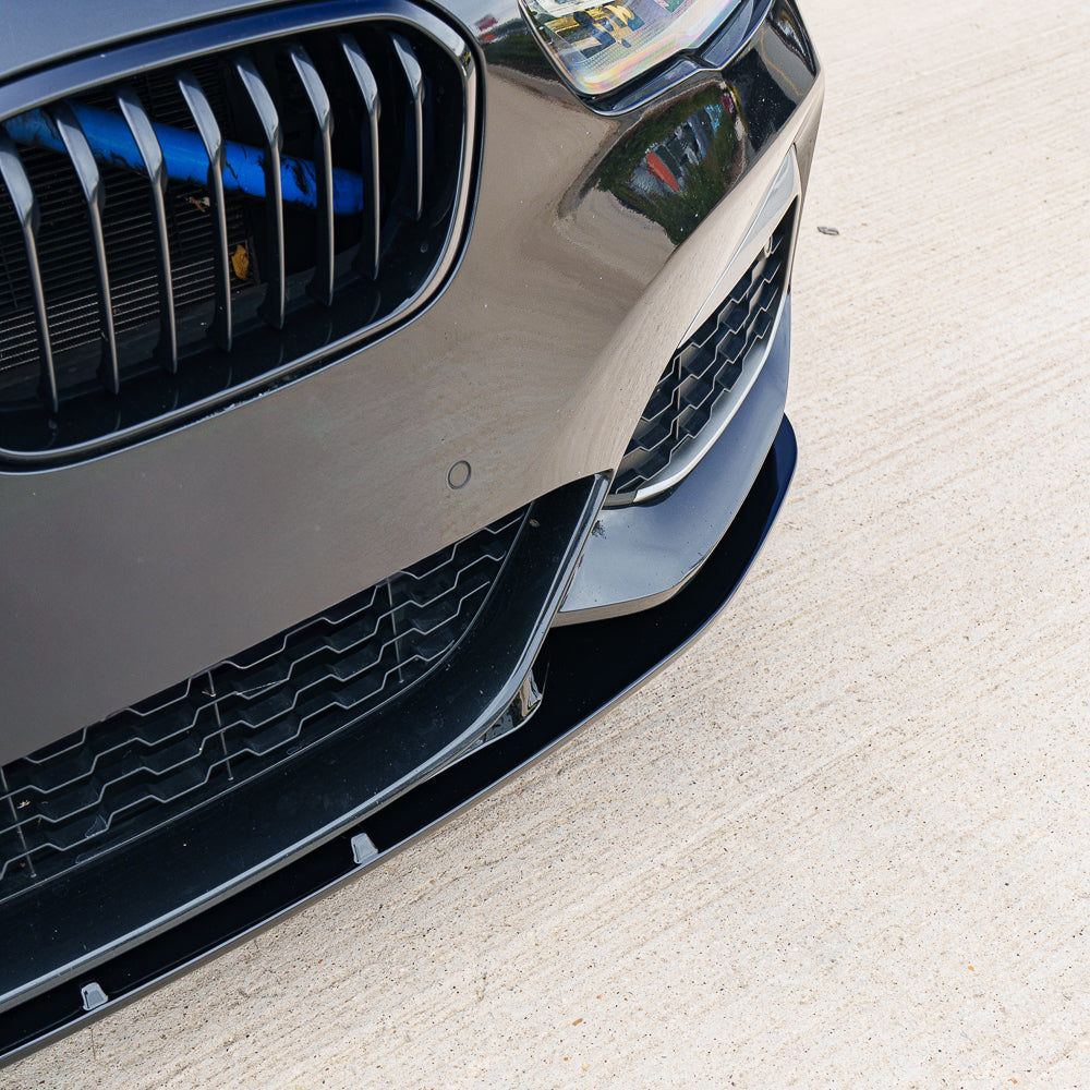 BMW F20/F21 1 Series LCI GLOSS BLACK splitter by CT Carbon, V2 model, showcasing the sleek aerodynamic design.