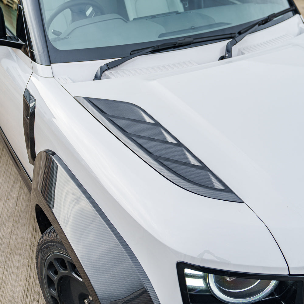 CT Carbon Land Rover Defender L663 bonnet vents in carbon fiber, designed for 90/110/130 models, enhancing style and airflow.