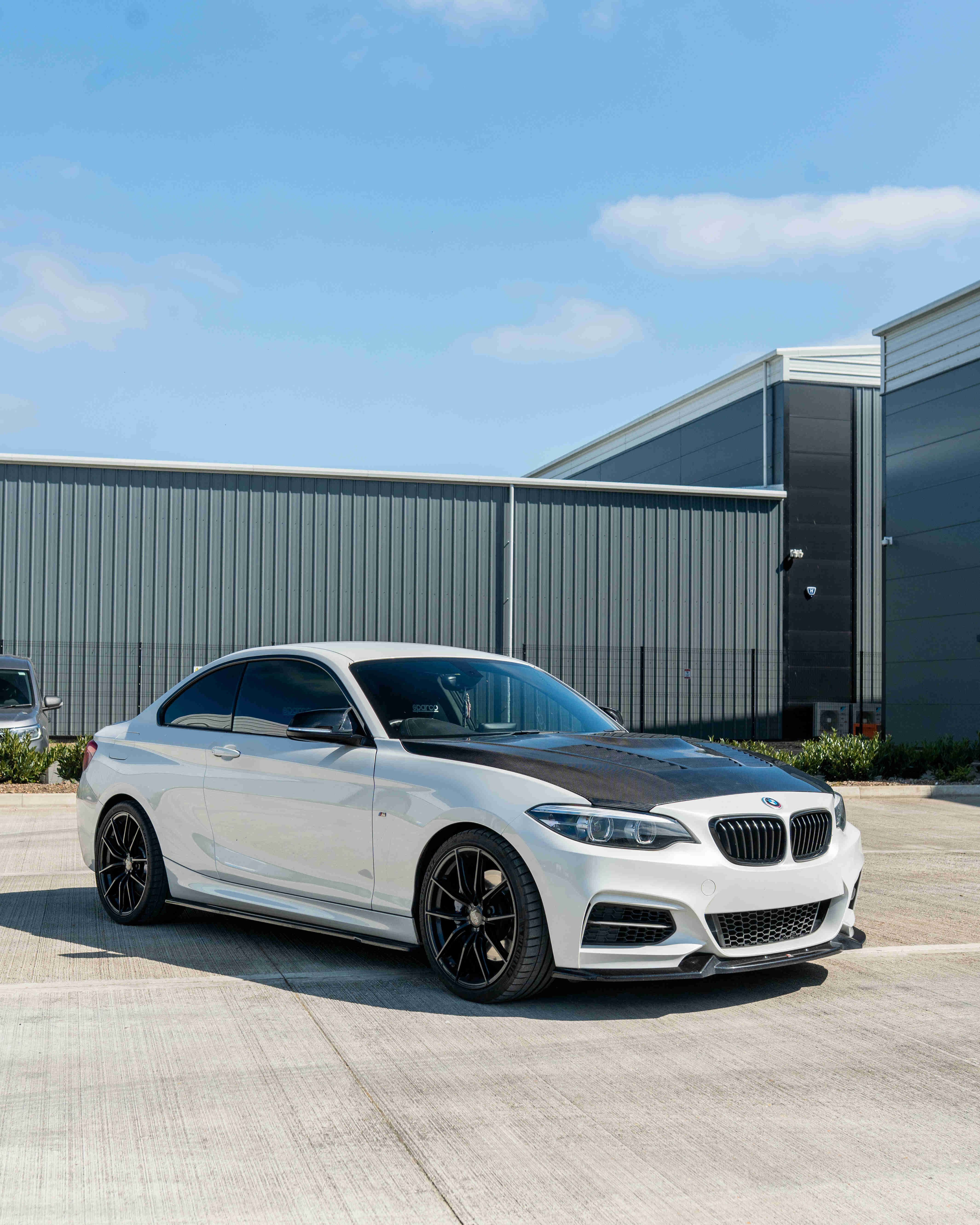 BMW M2 F87, M2C, F20, F22 1 & 2 Series carbon fibre bonnet by CT Carbon, showing sleek, lightweight hood with detailed weave pattern.
