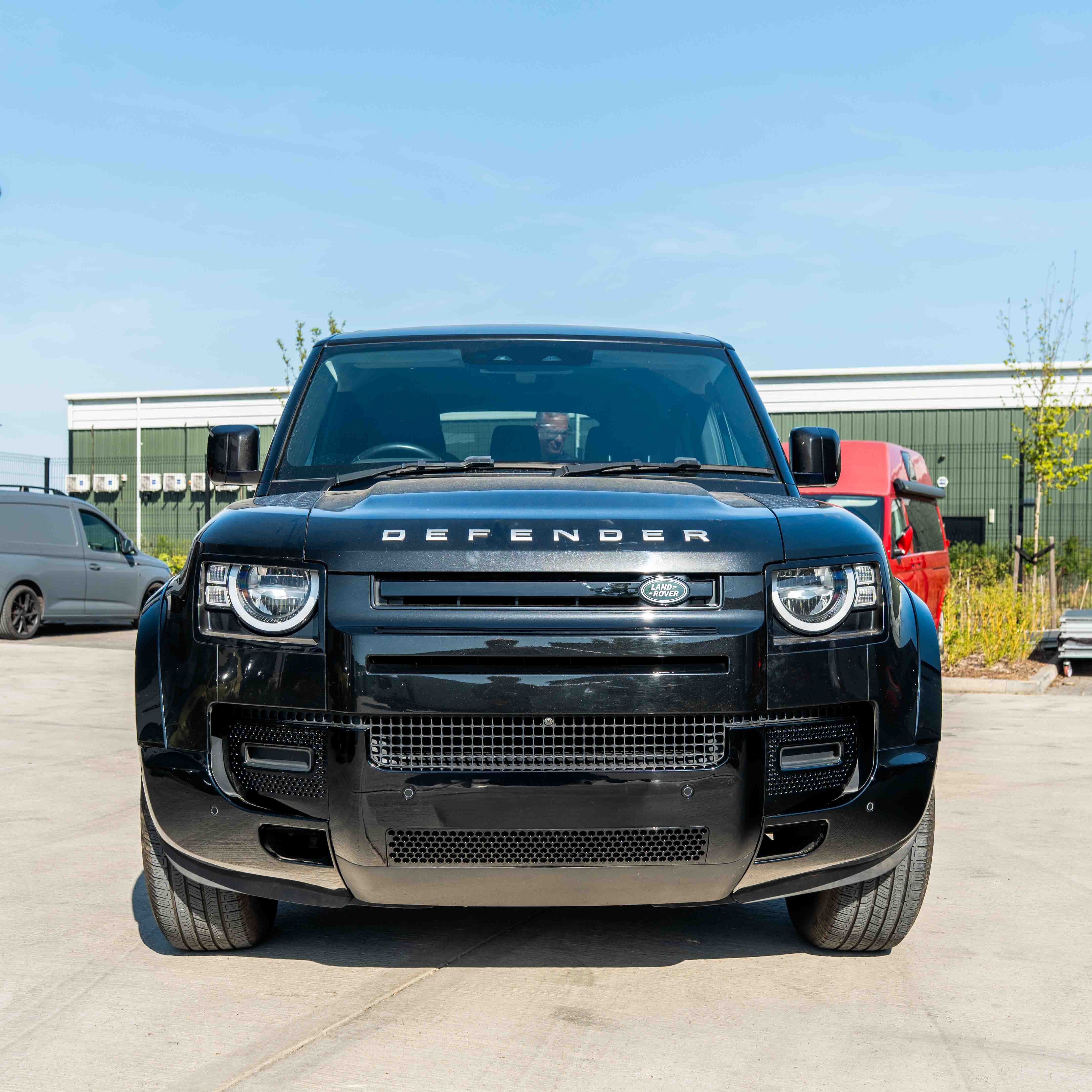 CT Carbon Land Rover Defender L663 110 & 90 gloss black front and rear middle trim kit shown in the image.