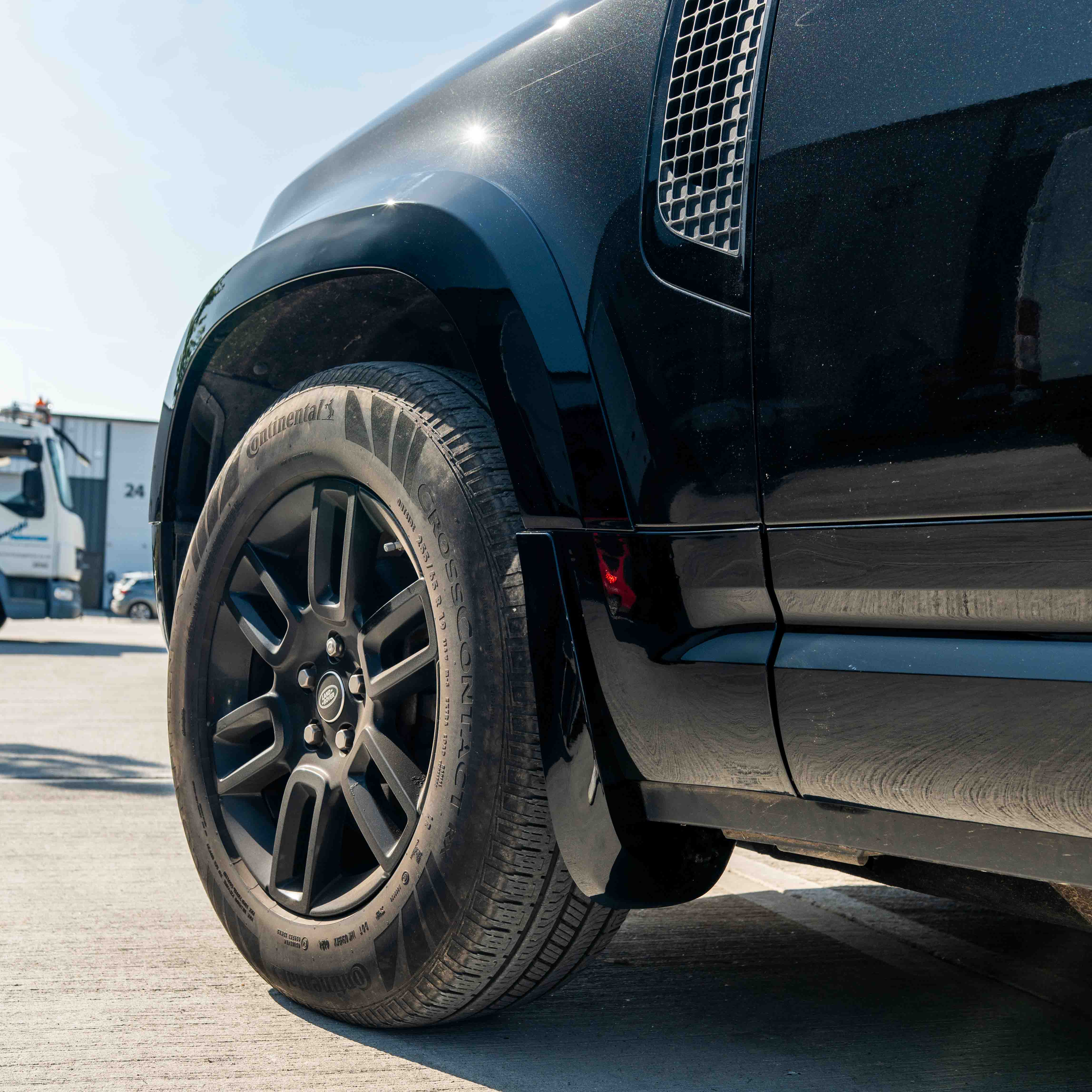 CT Carbon Land Rover Defender L663 110 & 90 gloss black front and rear middle trim kit, durable and stylish for vehicle interior.