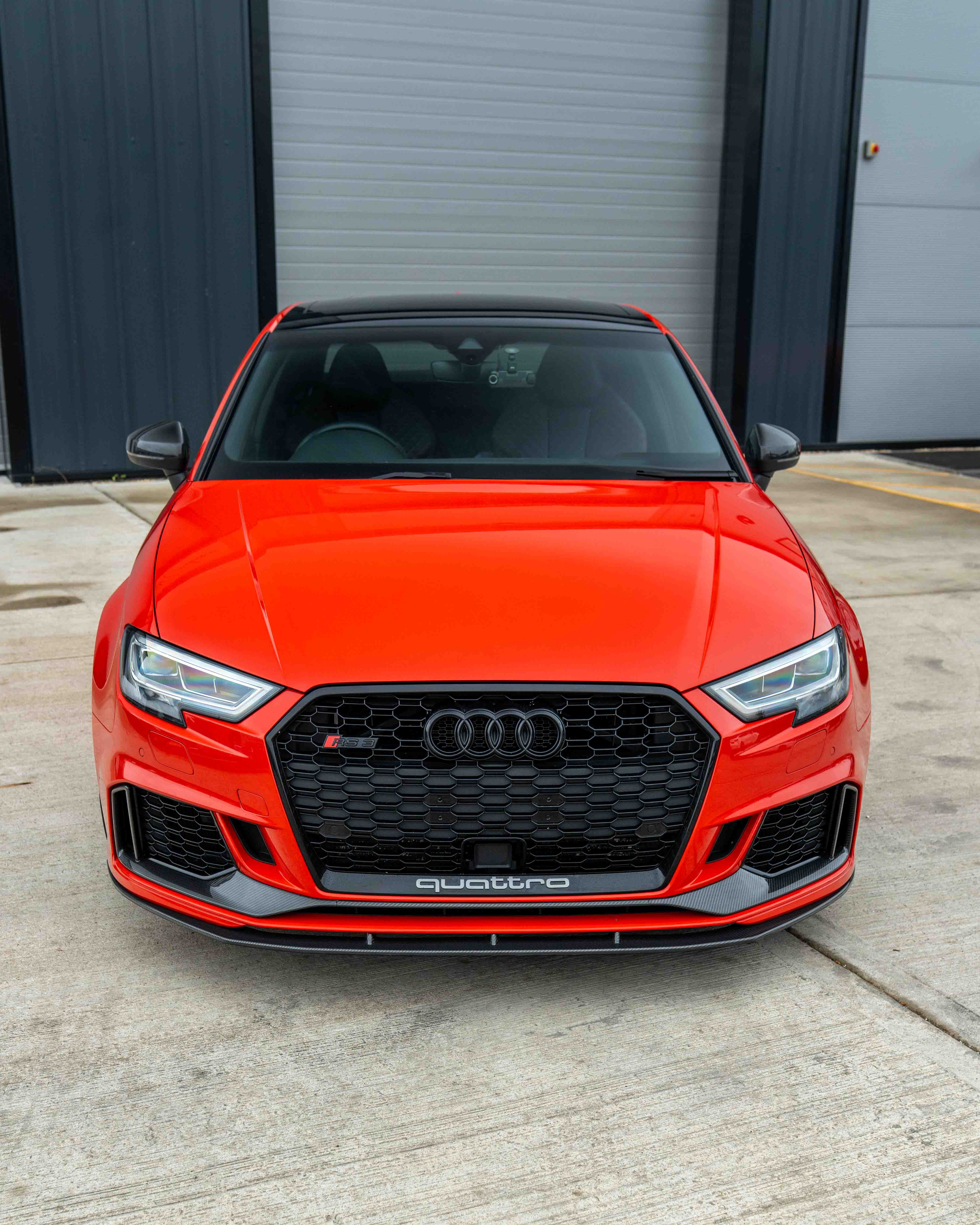 CT Carbon Audi RS3 8V saloon carbon fibre splitter V1 installed on front bumper, showcasing lightweight aerodynamic design.