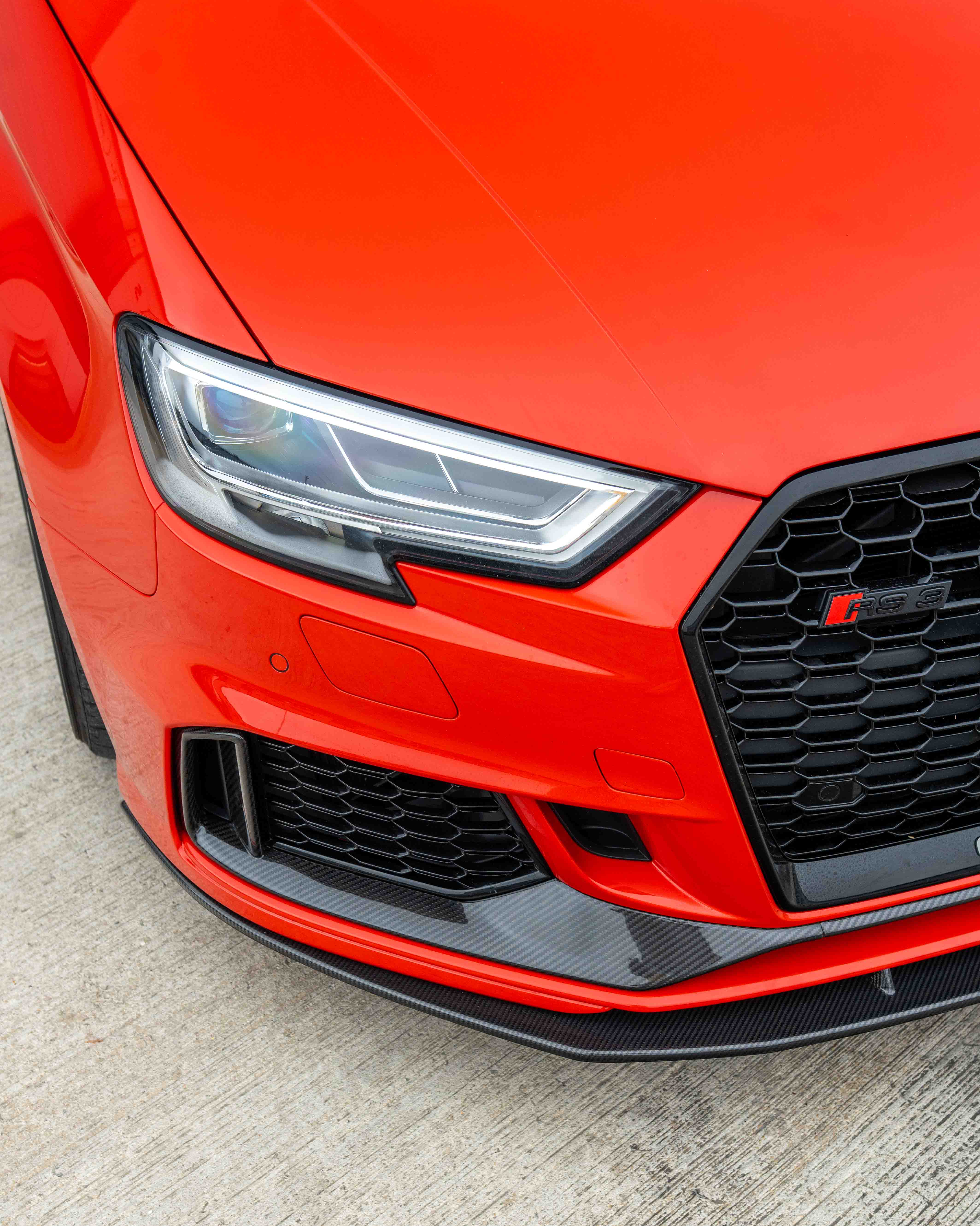 Audi RS3 8V facelift carbon fiber bumper trim by CT Carbon, close-up view showing sleek, lightweight exterior accessories.