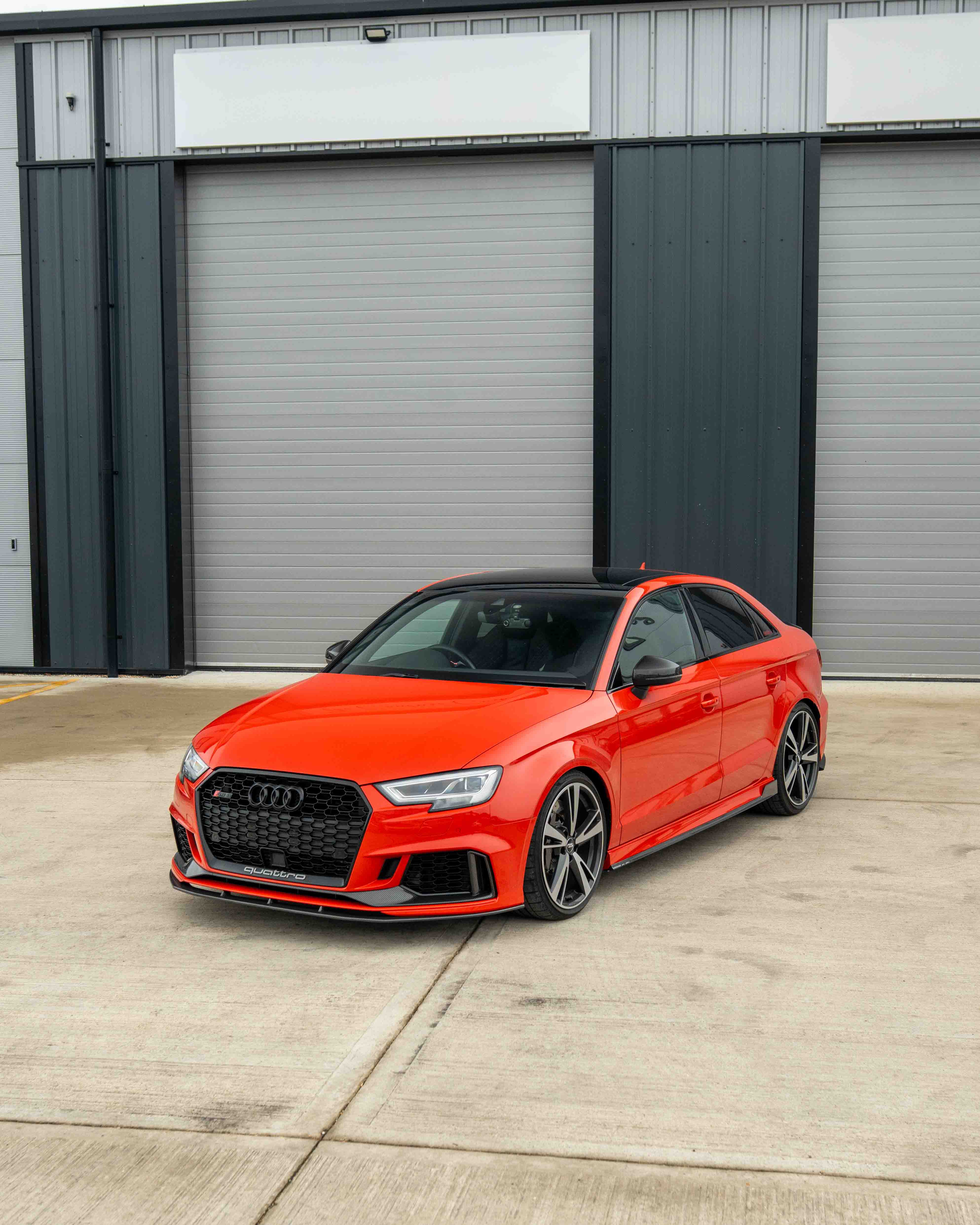 Audi RS3 8V facelift carbon fibre bumper trim by CT Carbon, close-up of sleek, lightweight automotive accessory on a white background.