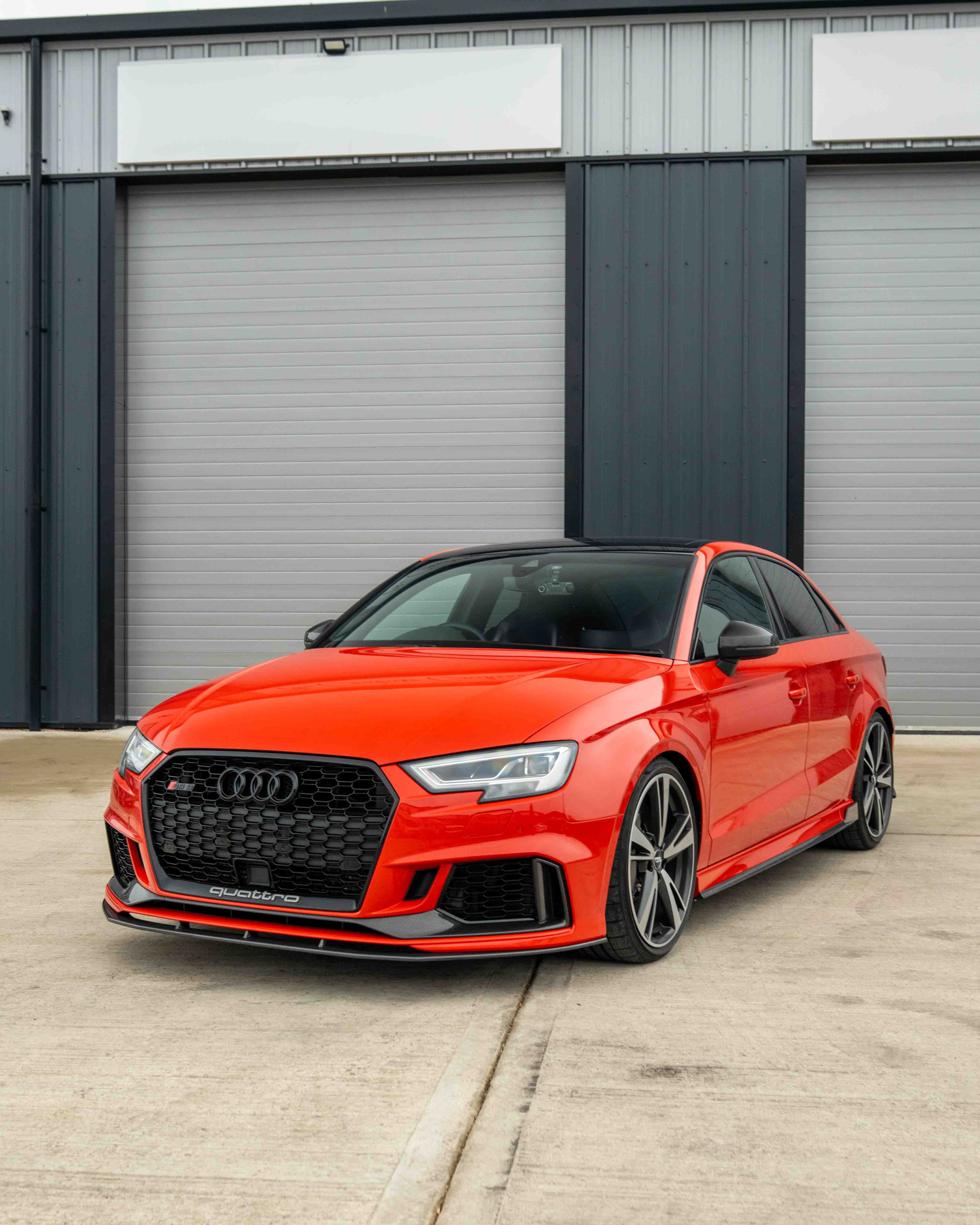 Carbon fibre side skirts for Audi A3/S3/RS3 8V saloon by CT Carbon, showing sleek, textured exterior enhancement.