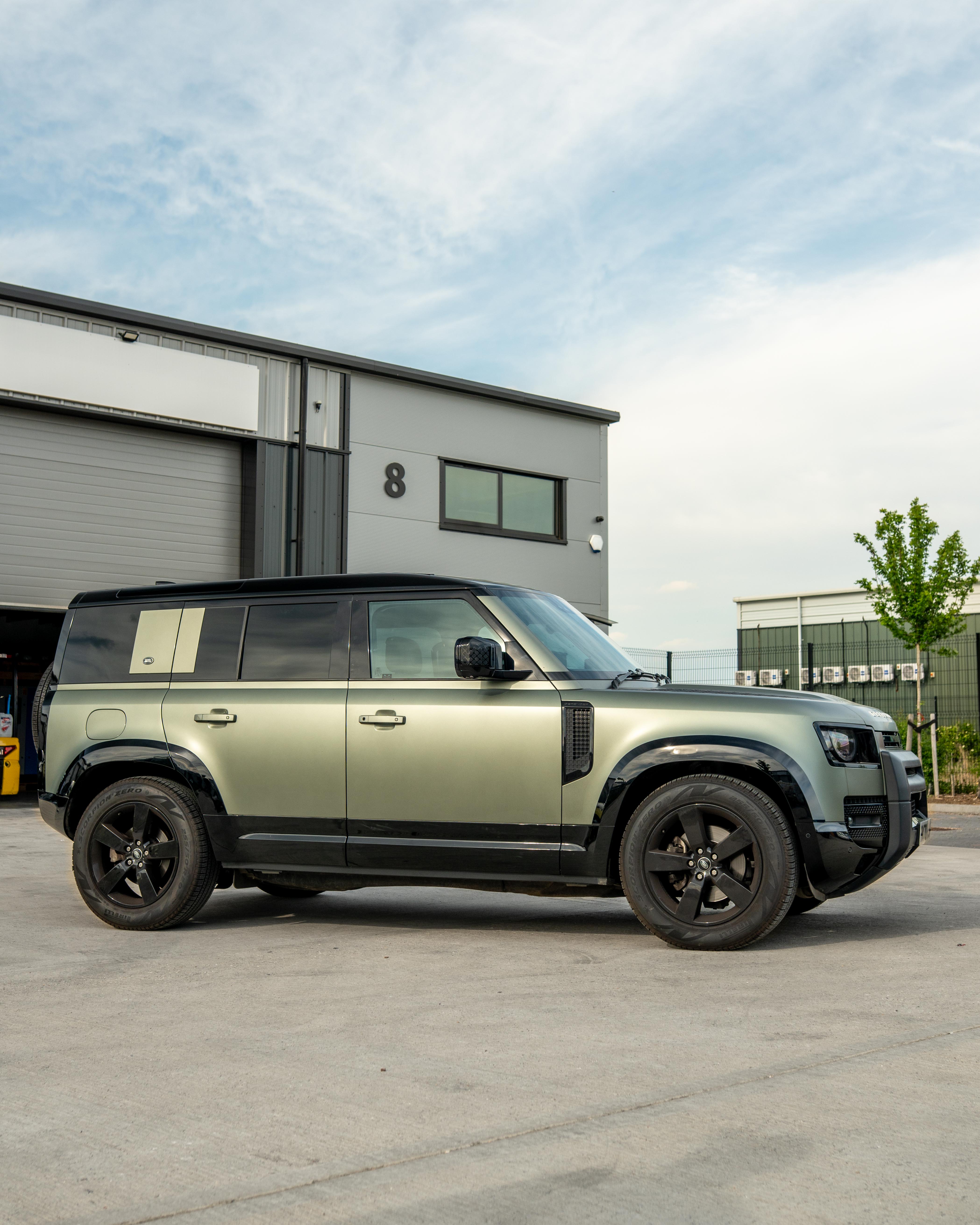 Gloss black door panels for Land Rover Defender L663 110 by CT Carbon, featuring sleek, high-quality automotive interior accents.
