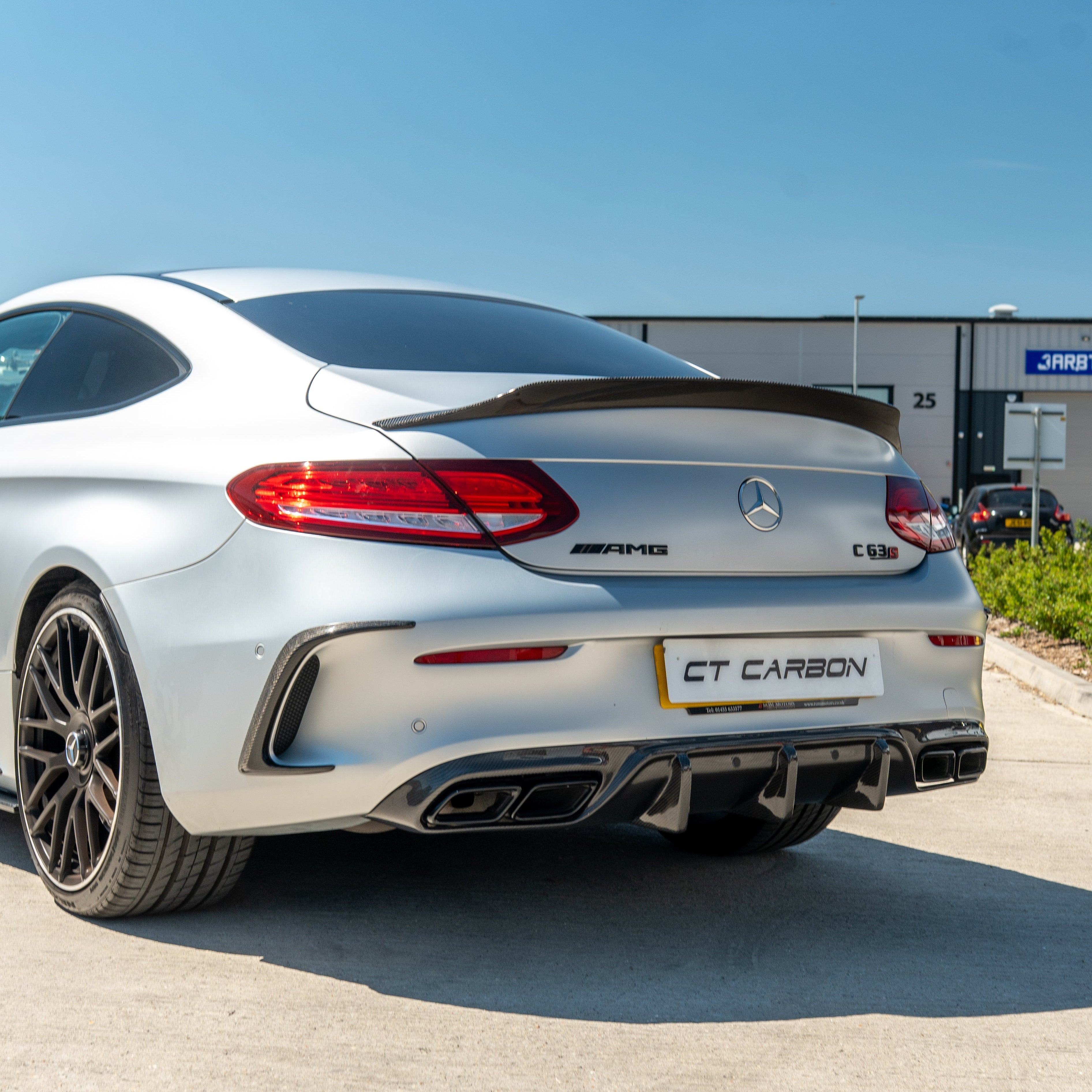 Carbon fiber canards for Mercedes W205 C63 & C63S coupe rear bumper, CT Carbon accessories with detailed aerodynamic design.