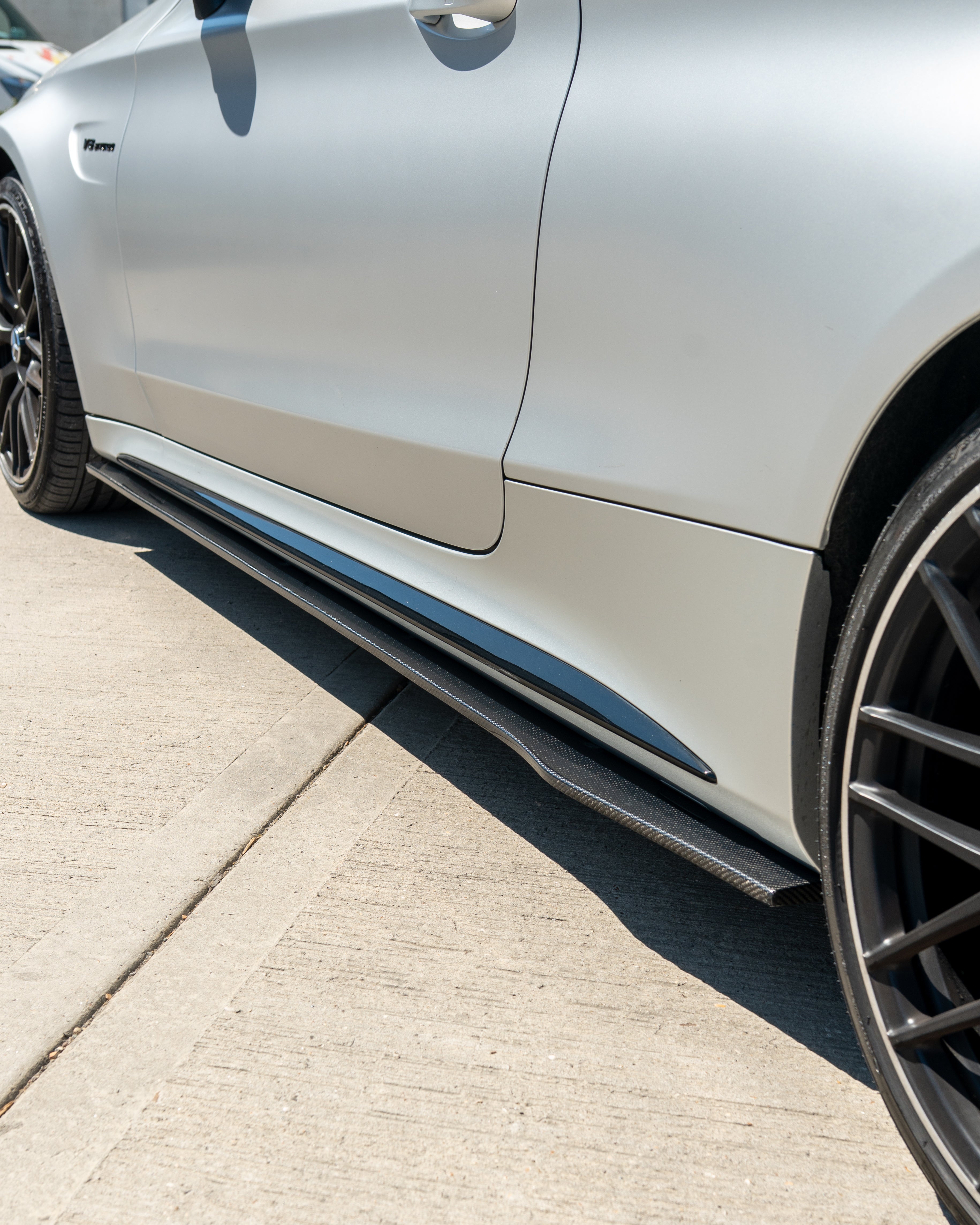 CT Carbon Mercedes W205 C63 and C63S coupe and saloon side skirts in carbon fiber, shown on the car's side profile.