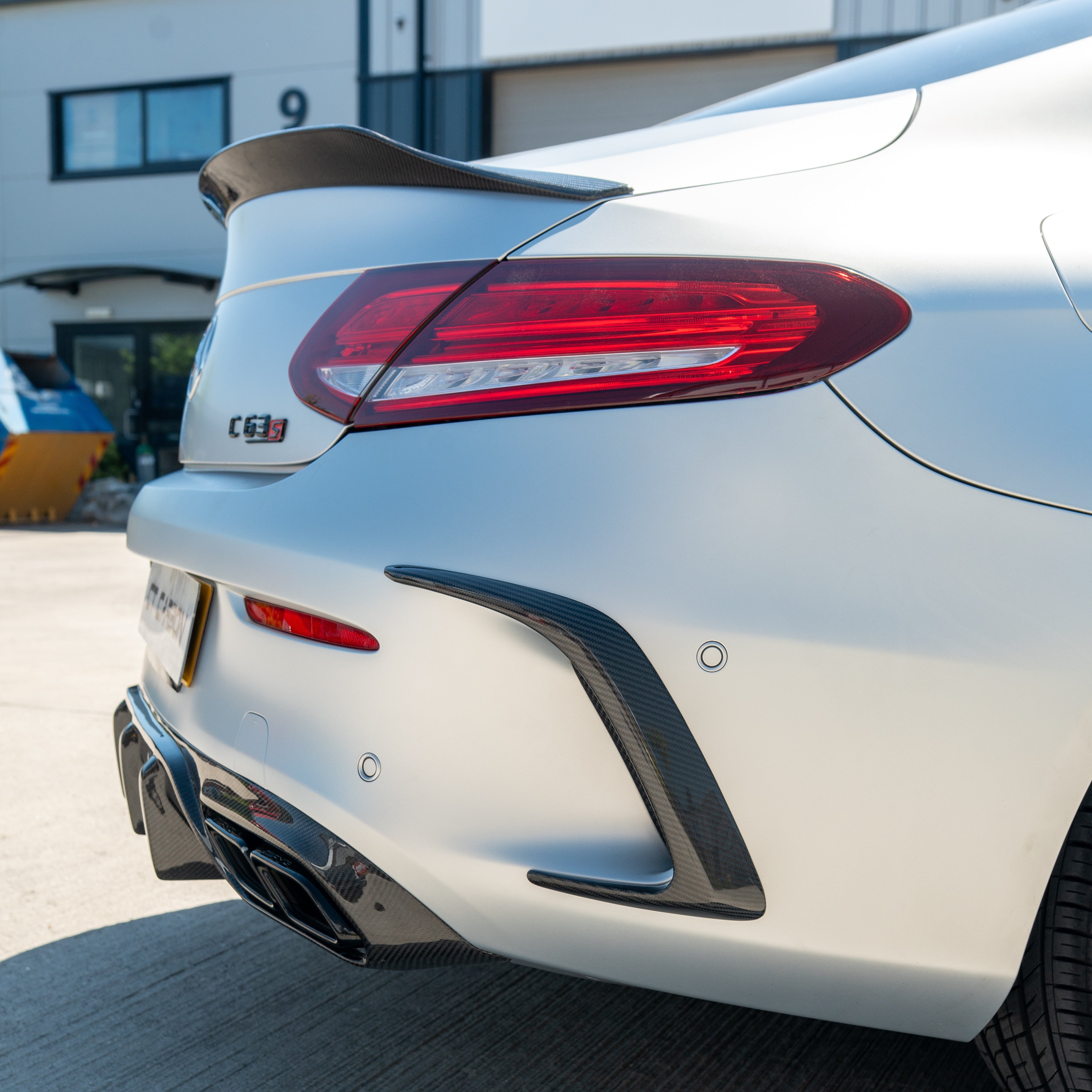 CT Carbon rear bumper canards for Mercedes W205 C63 and C63S coupe, made of lightweight carbon fiber, enhancing sporty look.