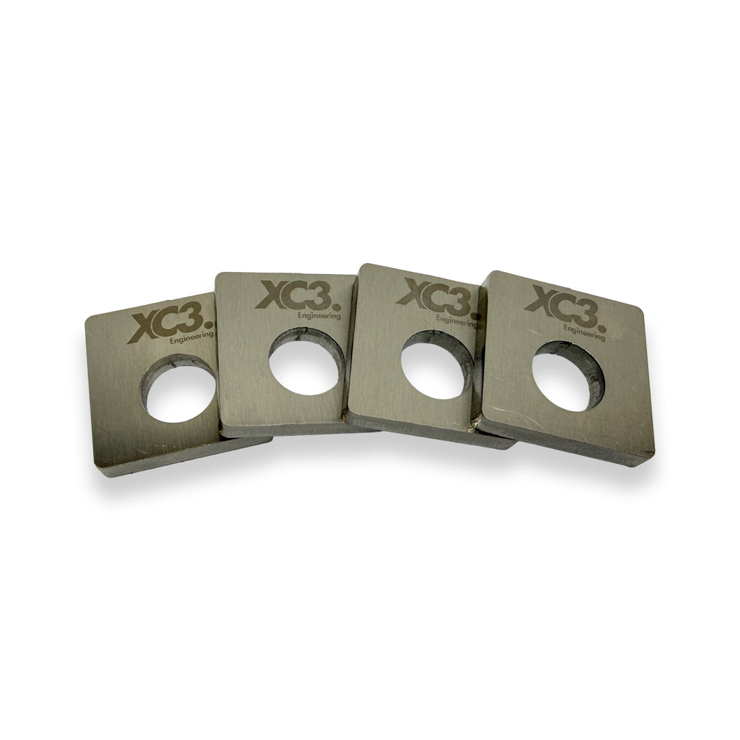 BMW M3 E9X E92 camber lockout shims for suspension and alignment by XC3 Engineering, shown in the image.
