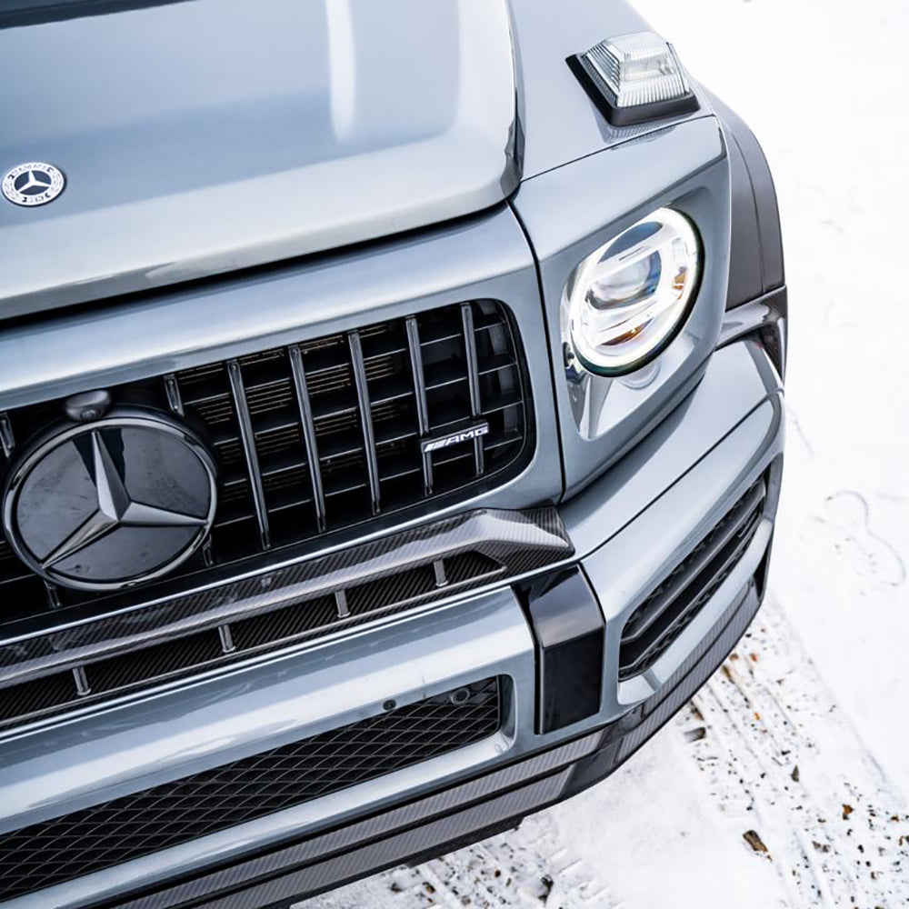 Mercedes-Benz G63 W463 2018-2024 wide arch kit by CT Carbon, featuring full carbon fiber fender flares on a black SUV.