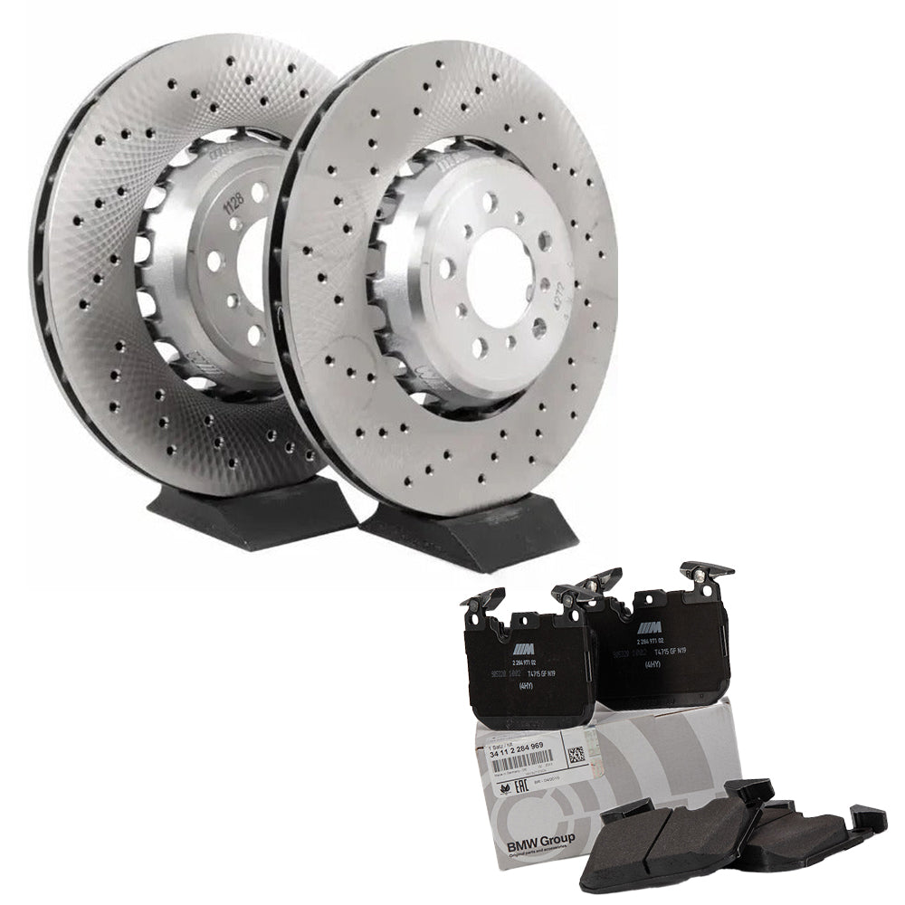 Two brake rotors with brake pads on a white background