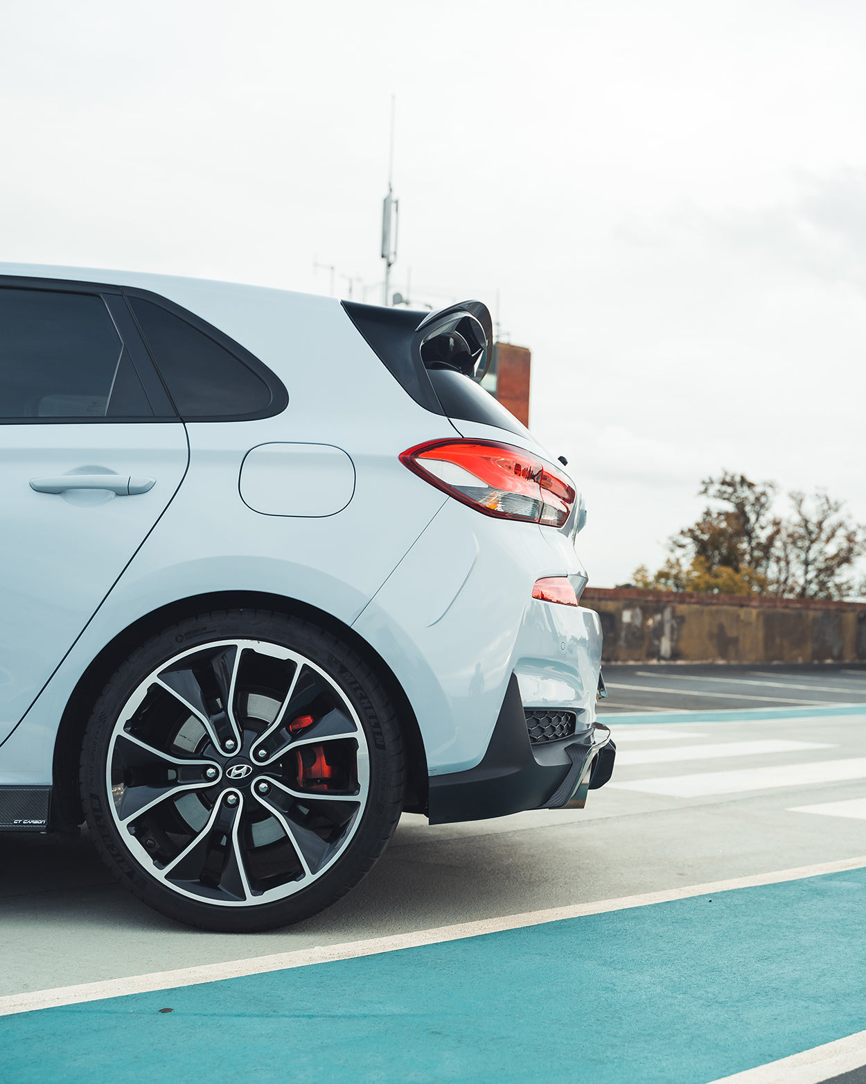 Hyundai i30N carbon fibre diffuser splitter by CT Design, pre-facelift model, showcasing sleek aerodynamic design and high-quality finish.