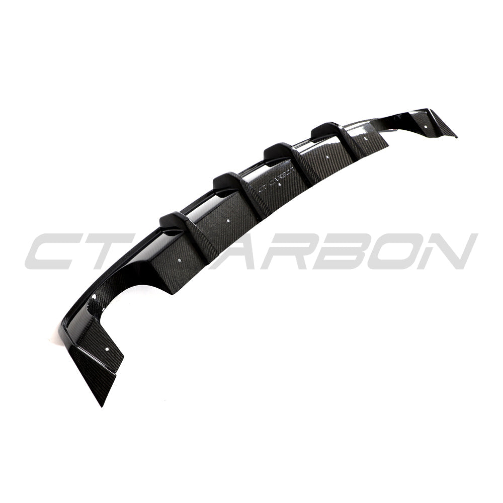 Hyundai i30N carbon fiber diffuser splitter by CT Carbon, pre-facelift model, showcasing sleek black carbon fiber finish.